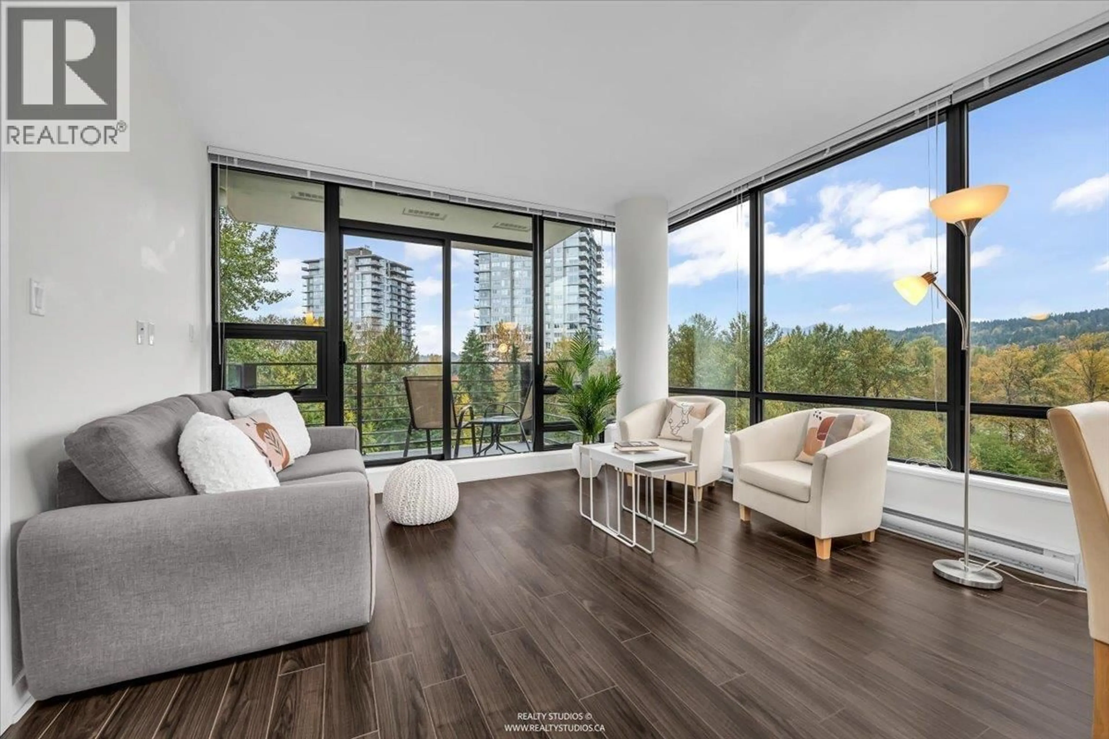Living room with furniture, wood/laminate floor for 803 - 301 CAPILANO ROAD, Port Moody British Columbia V3H0G6