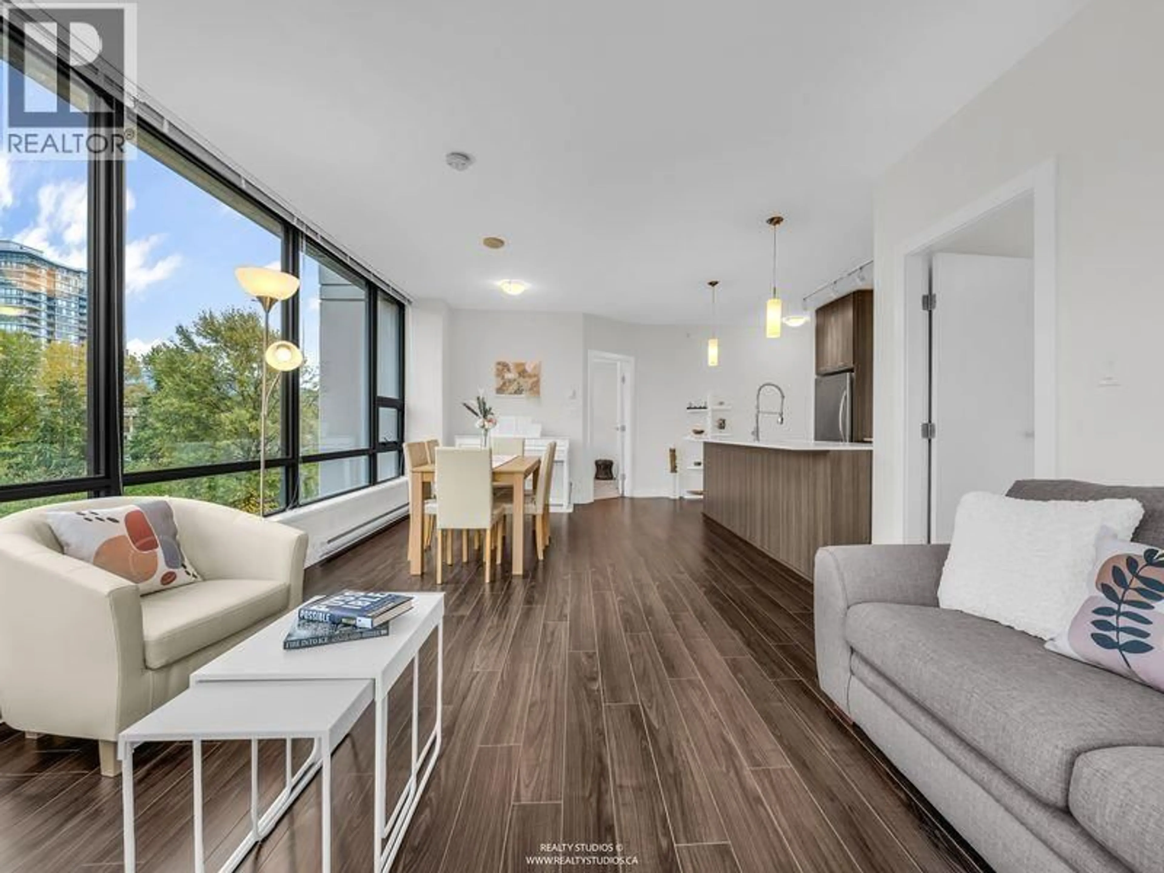 Living room with furniture, wood/laminate floor for 803 - 301 CAPILANO ROAD, Port Moody British Columbia V3H0G6