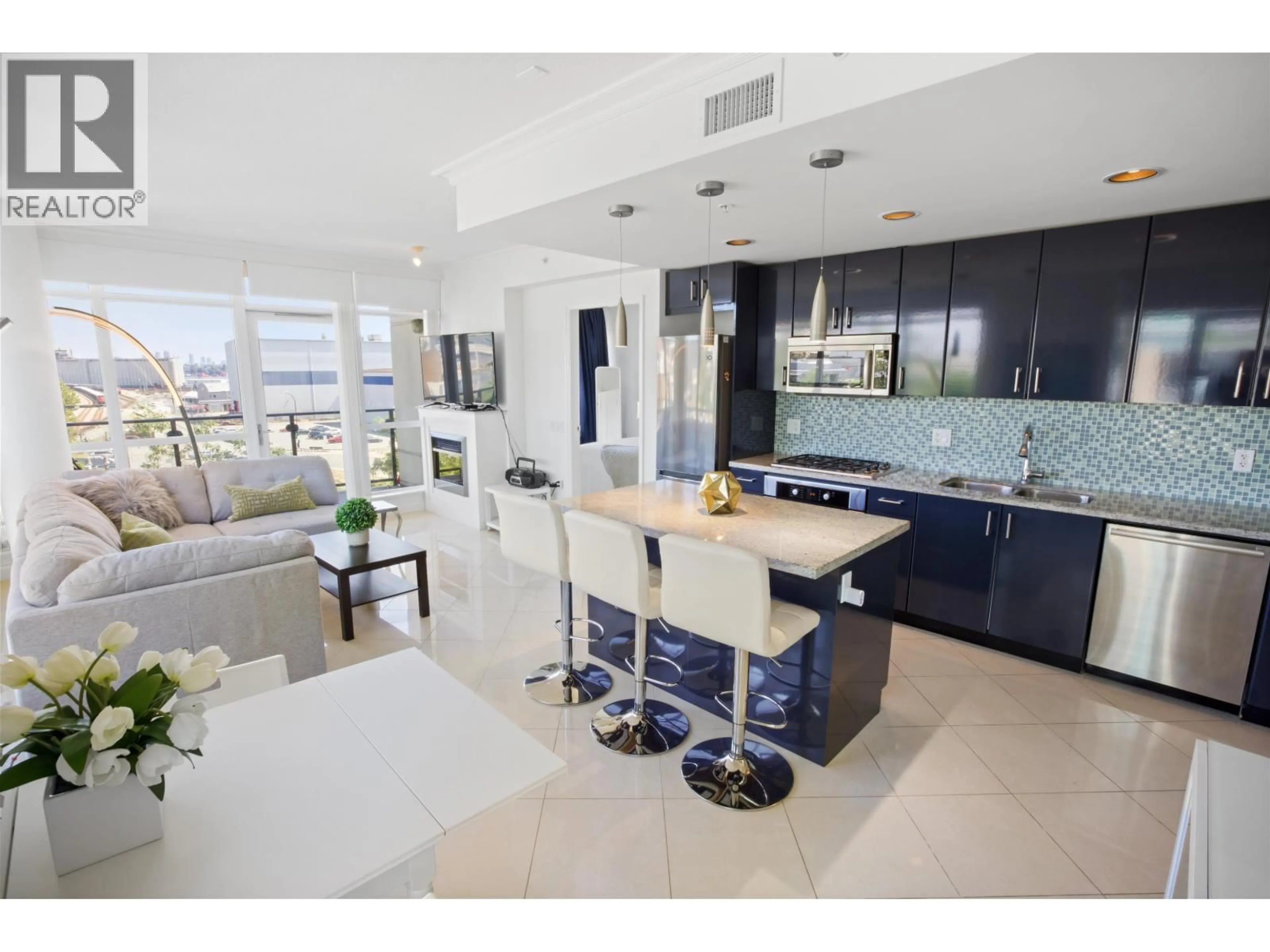 Open concept kitchen, ceramic/tile floor for 502 - 172 VICTORY SHIP WAY, North Vancouver British Columbia V7L0B5