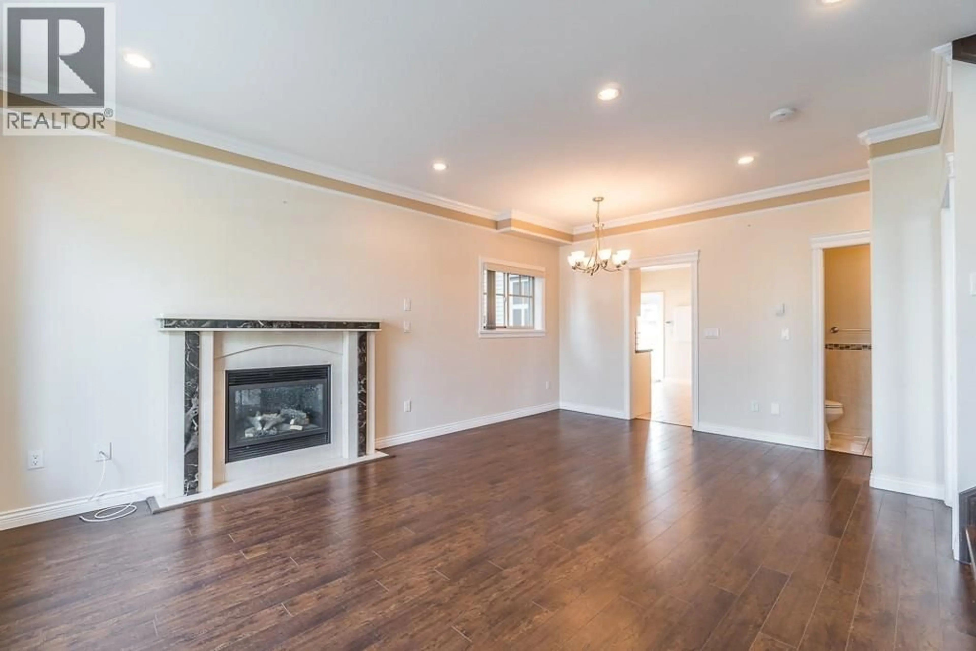 Living room with furniture, wood/laminate floor for 7734 16TH AVENUE, Burnaby British Columbia V3N1P9