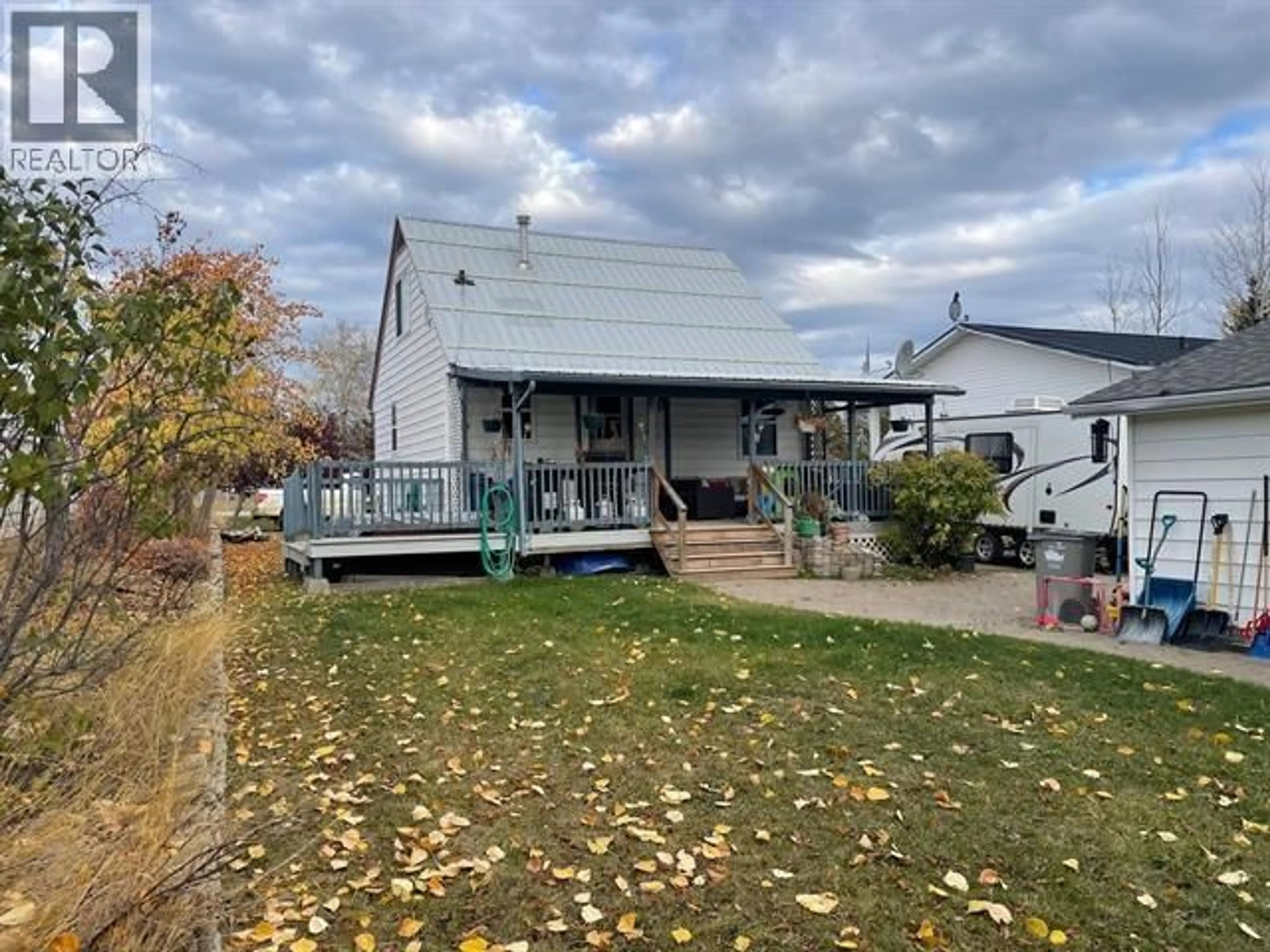 A pic from outside/outdoor area/front of a property/back of a property/a pic from drone, street for 4711 SPRUCE AVENUE, Fort Nelson British Columbia V0C1R0