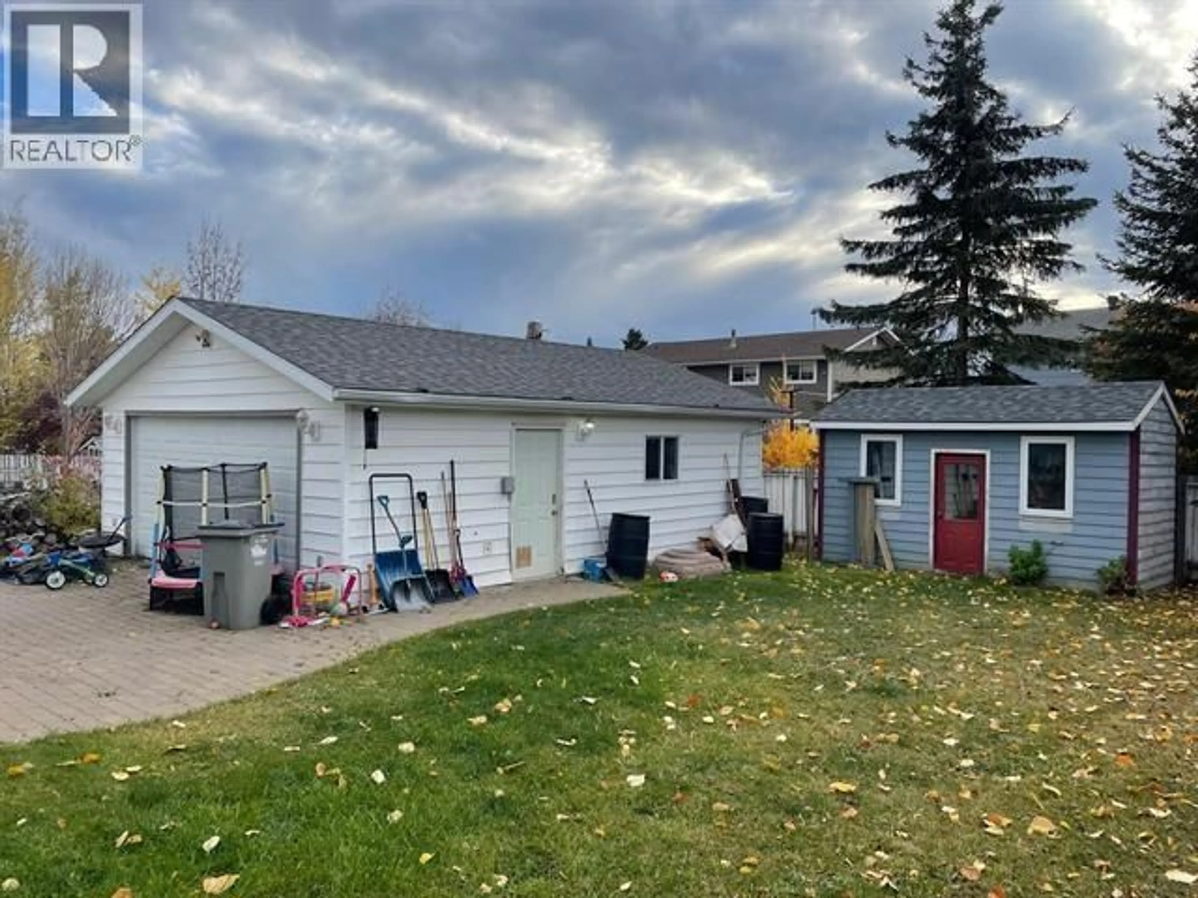A pic from outside/outdoor area/front of a property/back of a property/a pic from drone, street for 4711 SPRUCE AVENUE, Fort Nelson British Columbia V0C1R0