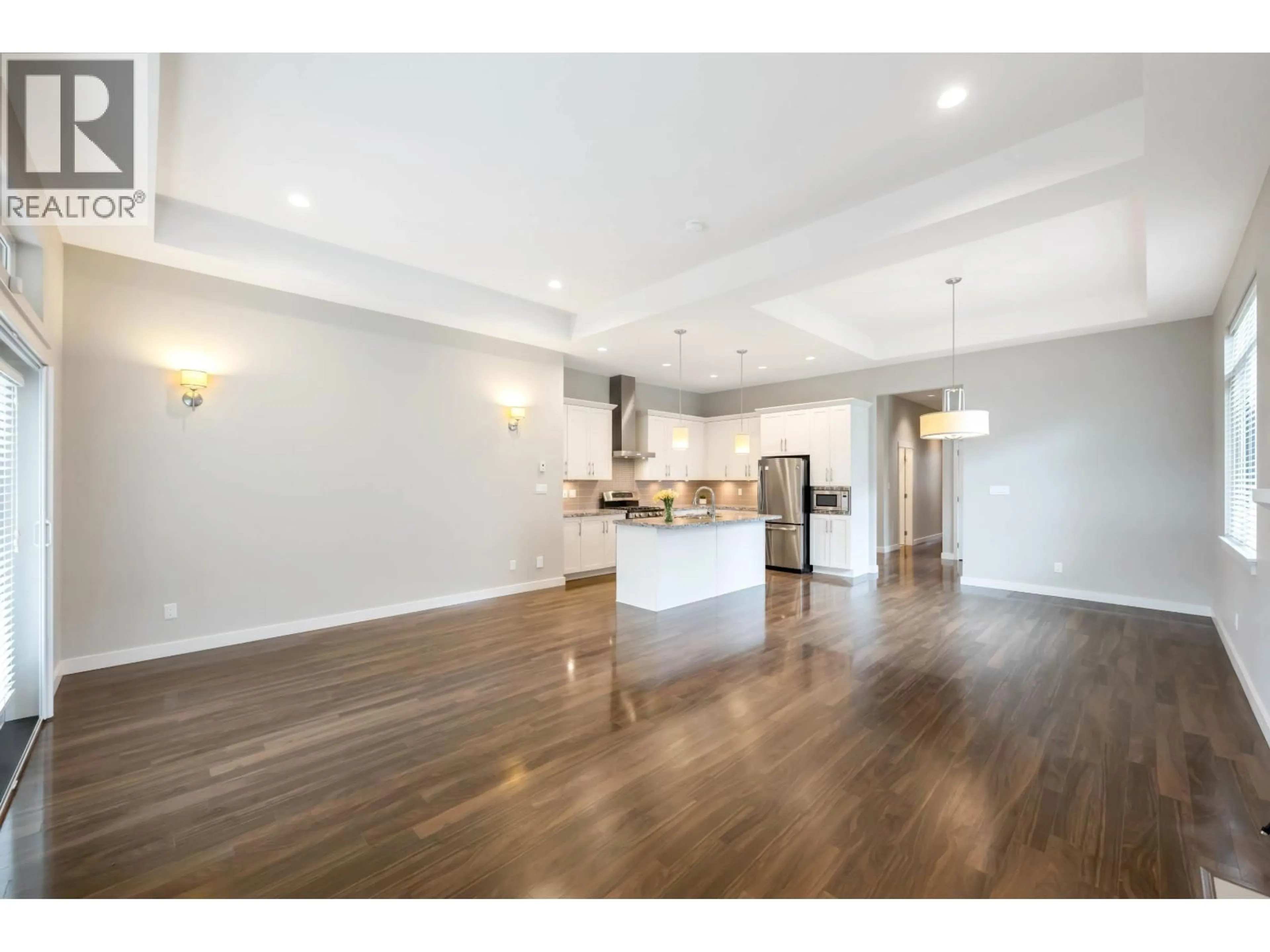 Open concept kitchen, wood/laminate floor for 5036 SPRINGS BOULEVARD, Delta British Columbia V4M0A7