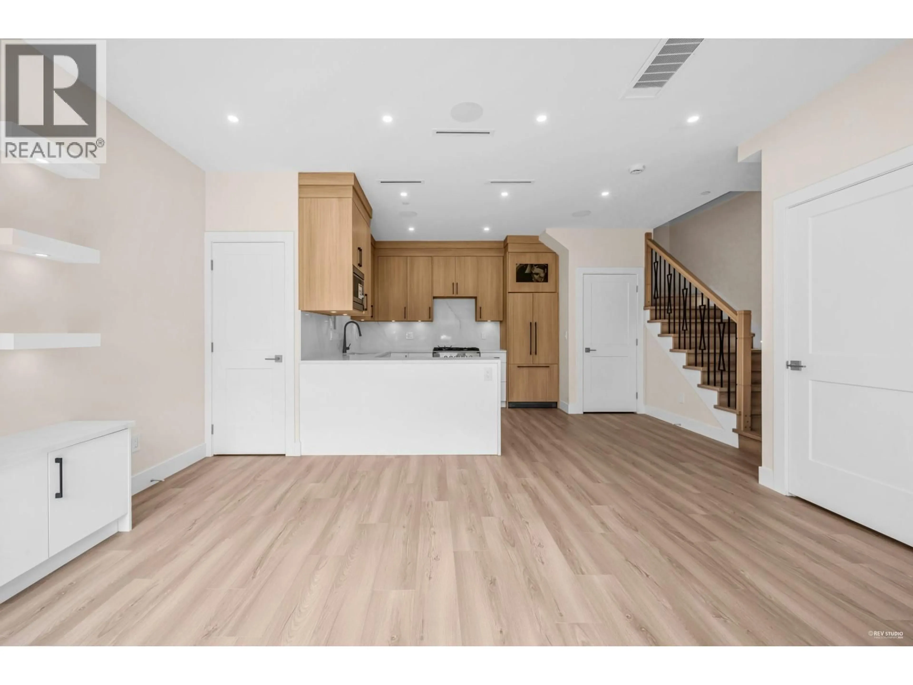Open concept kitchen, wood/laminate floor for 2371 ADANAC STREET, Vancouver British Columbia V5L2E9