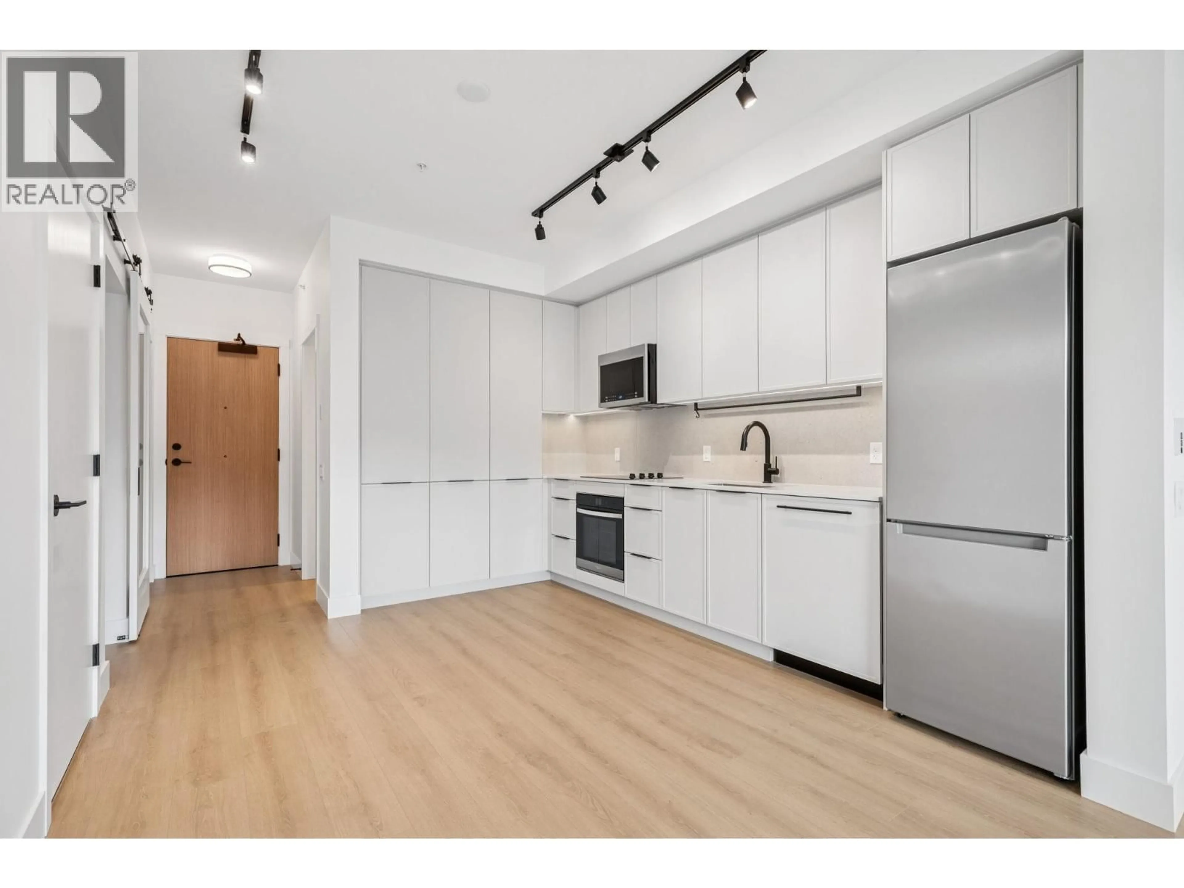 Open concept kitchen, wood/laminate floor for 307 - 3075 MURRAY STREET, Port Moody British Columbia V3H0N9