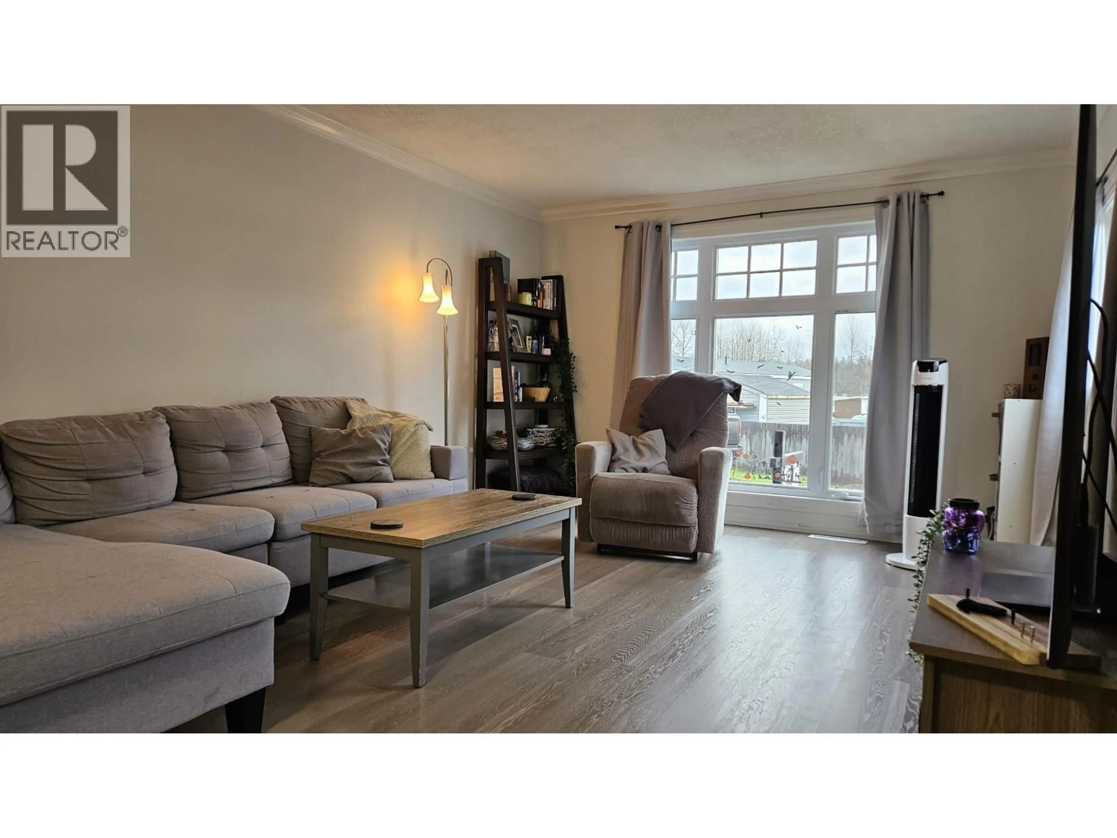 Living room with furniture, wood/laminate floor for A7 - 5931 COOK COURT, Prince George British Columbia V2K1V5