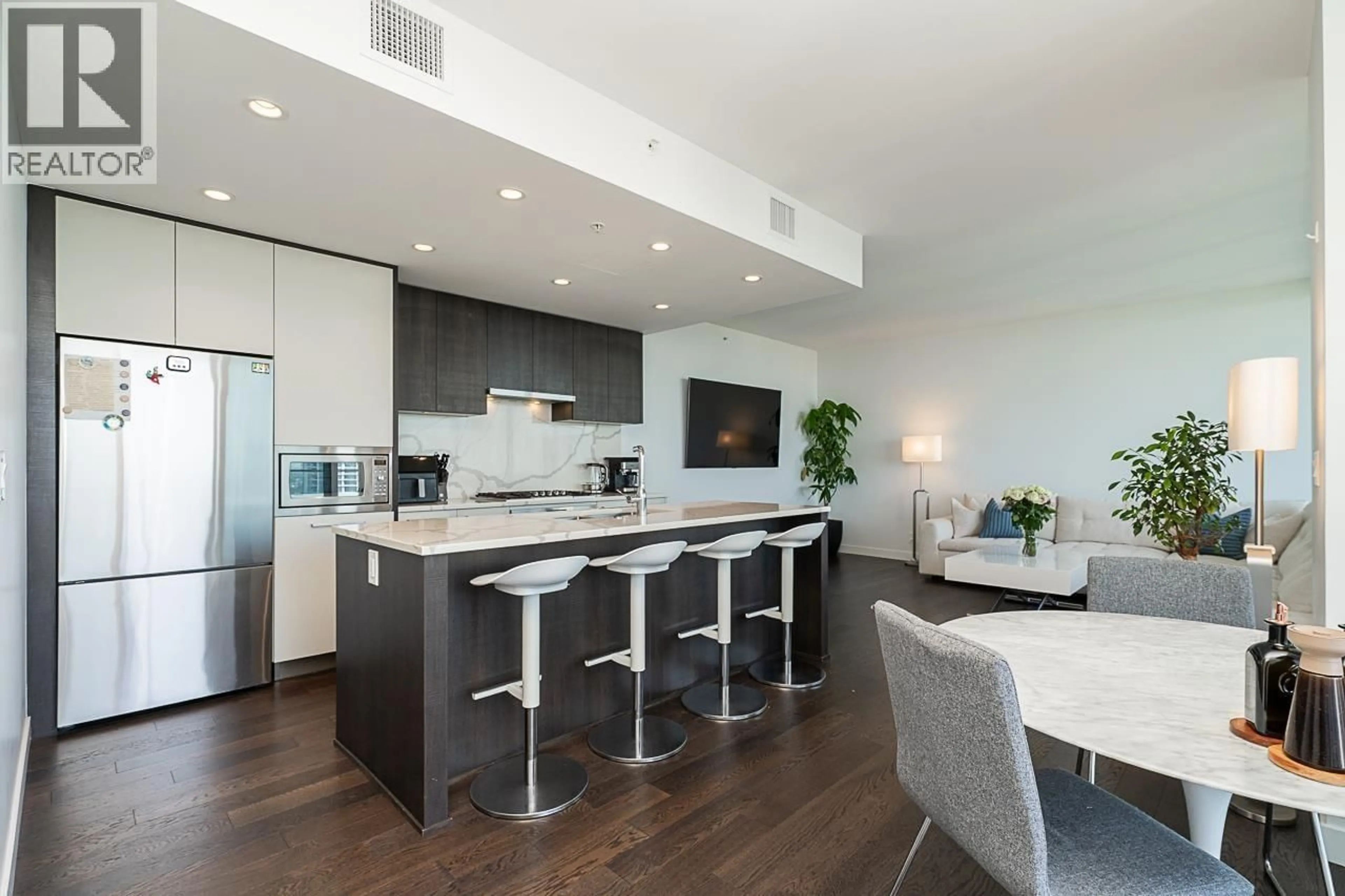 Open concept kitchen, wood/laminate floor for 4601 - 567 CLARKE ROAD, Coquitlam British Columbia V3J0K7