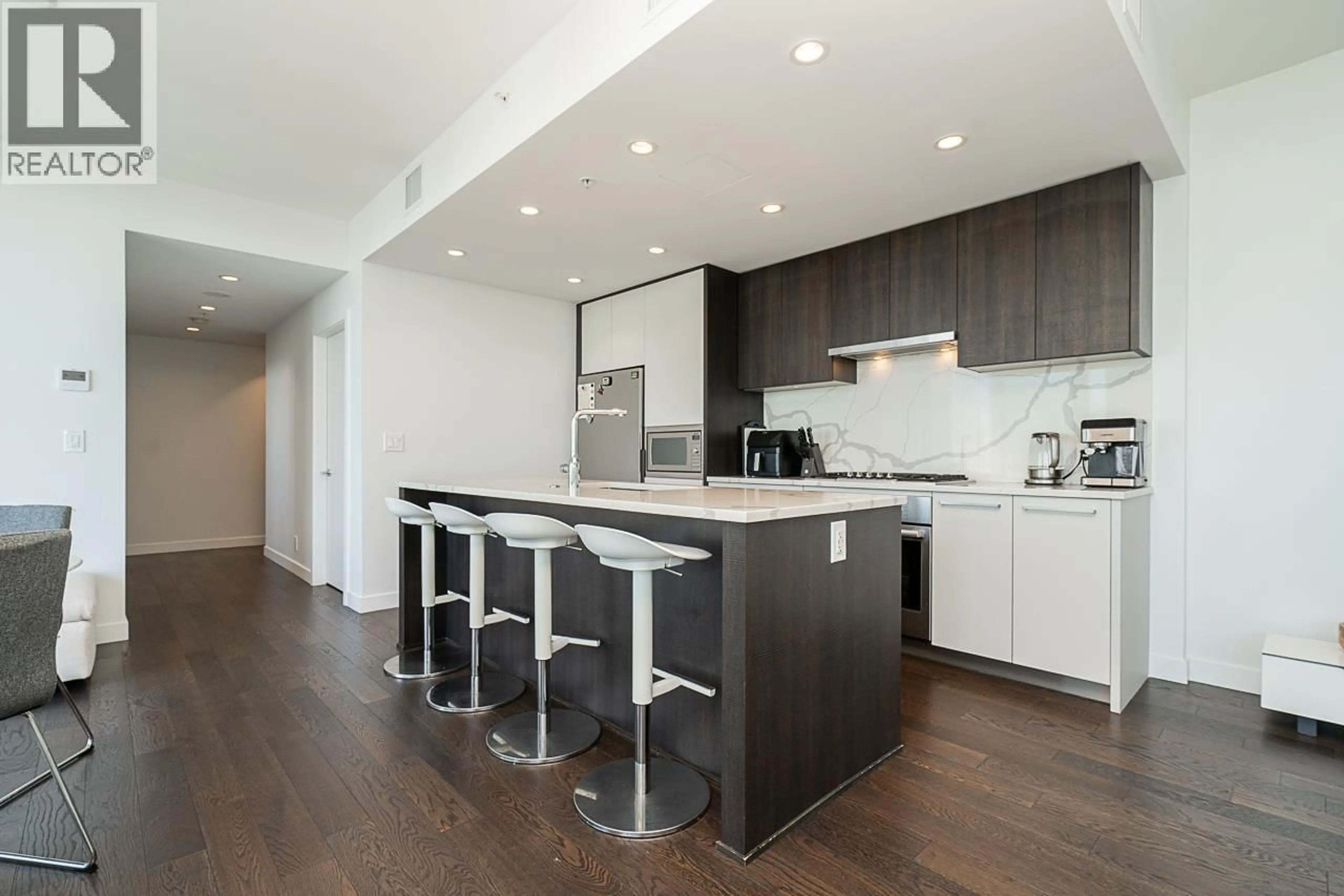 Open concept kitchen, wood/laminate floor for 4601 - 567 CLARKE ROAD, Coquitlam British Columbia V3J0K7