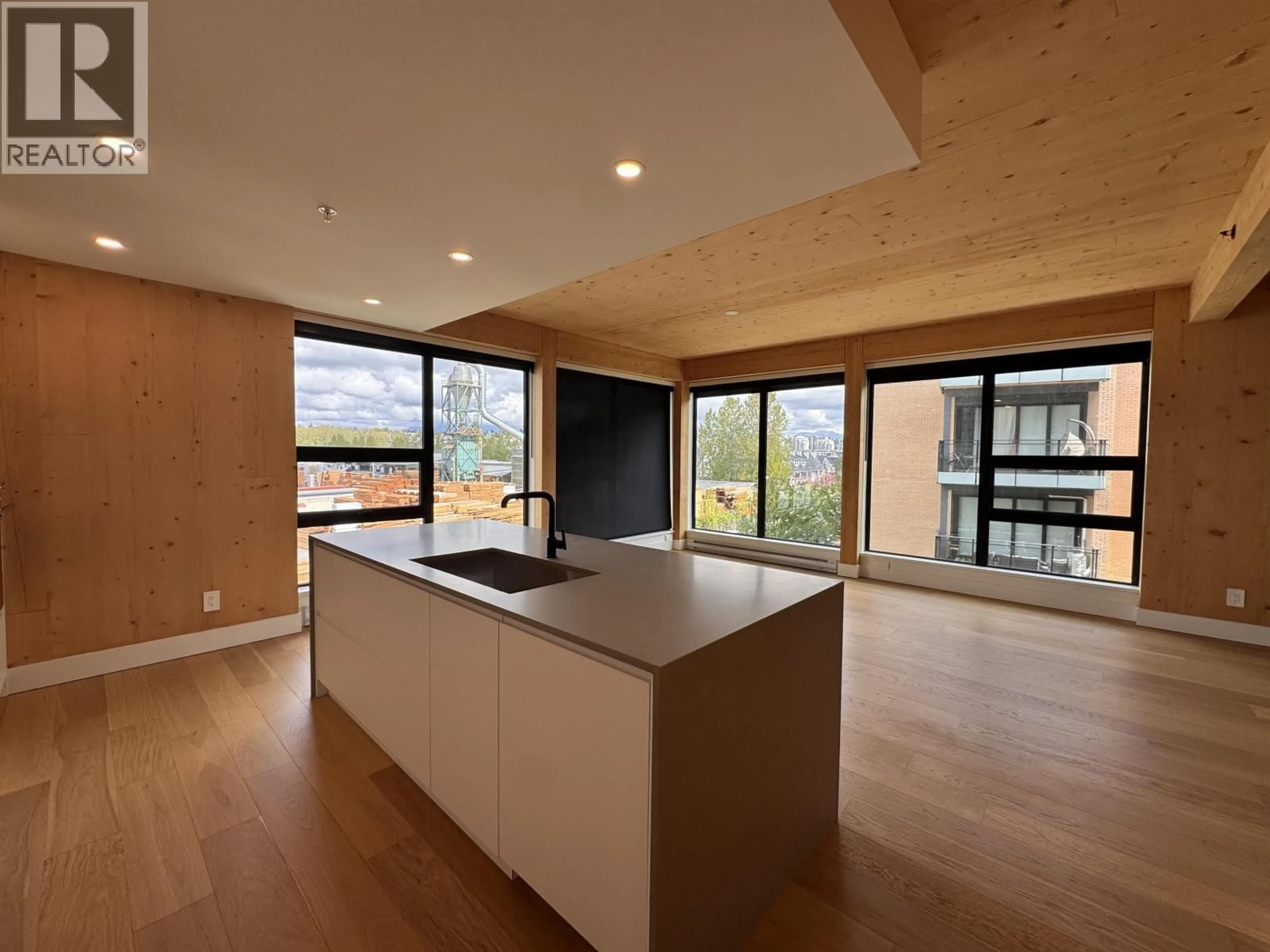 Open concept kitchen, wood/laminate floor for 201 - 310 SALTER STREET, New Westminster British Columbia V3M0N7