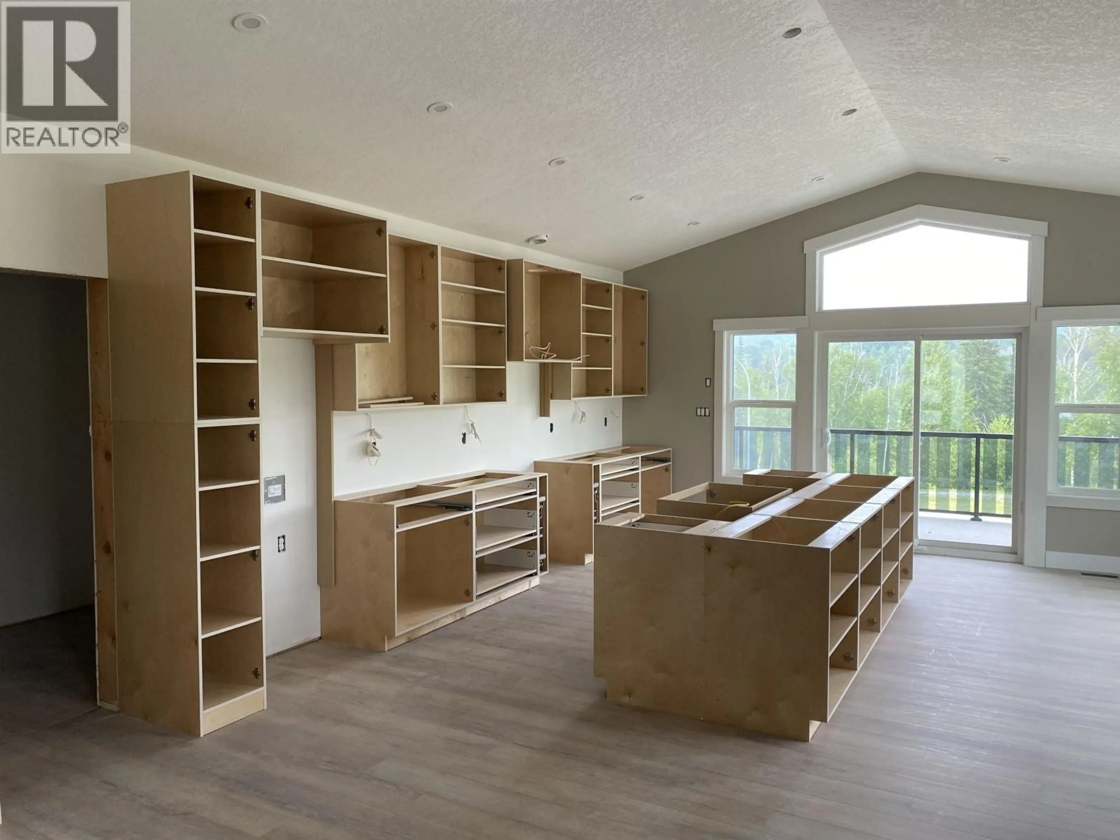 Open concept kitchen, wood/laminate floor for 7428 FOXRIDGE AVENUE, Prince George British Columbia V2N0H2