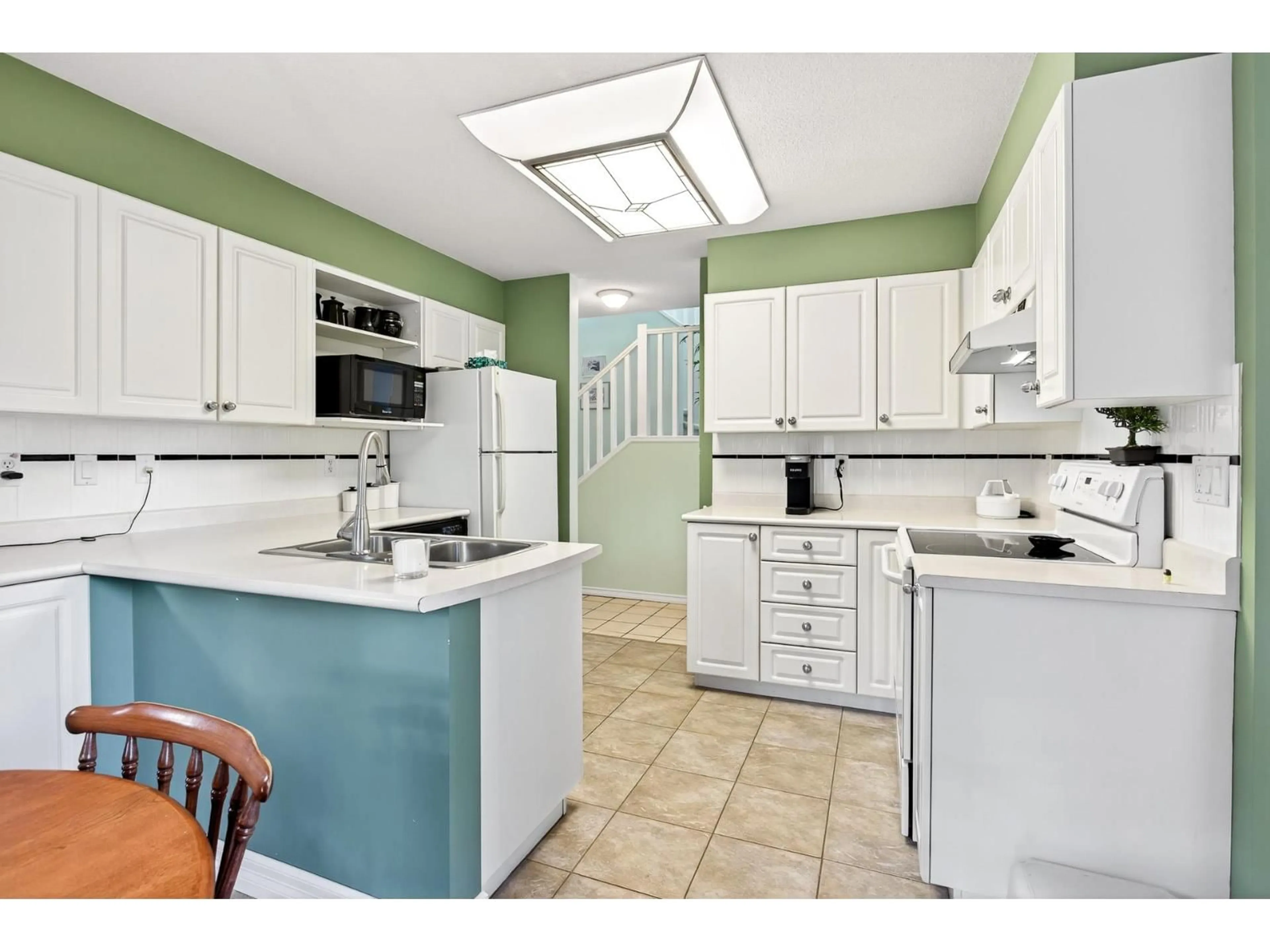 Standard kitchen, ceramic/tile floor for 101 - 16275 15, Surrey British Columbia V4A1L4