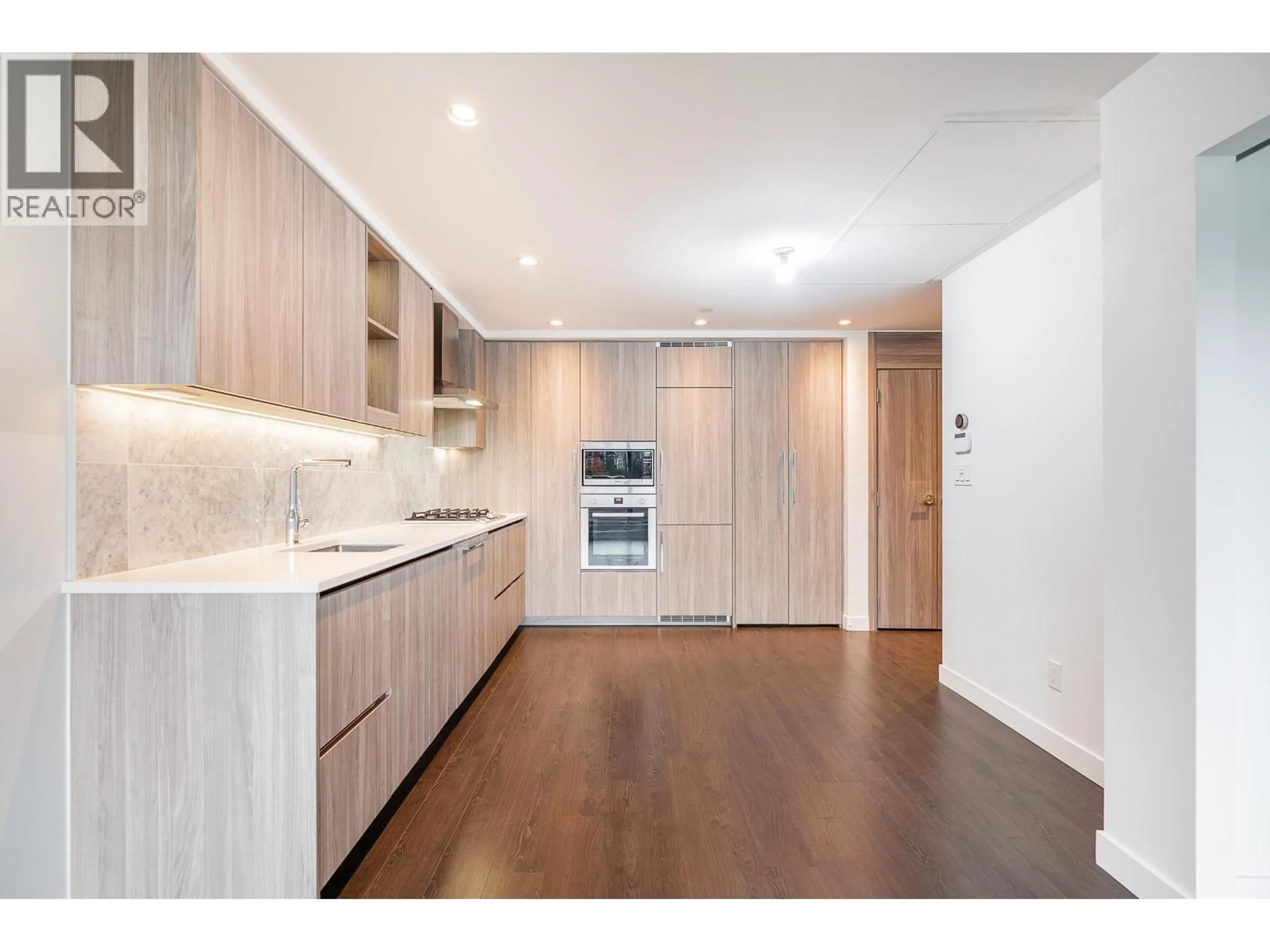 Open concept kitchen, wood/laminate floor for 306 - 4730 LOUGHEED HIGHWAY, Burnaby British Columbia V5C0M9