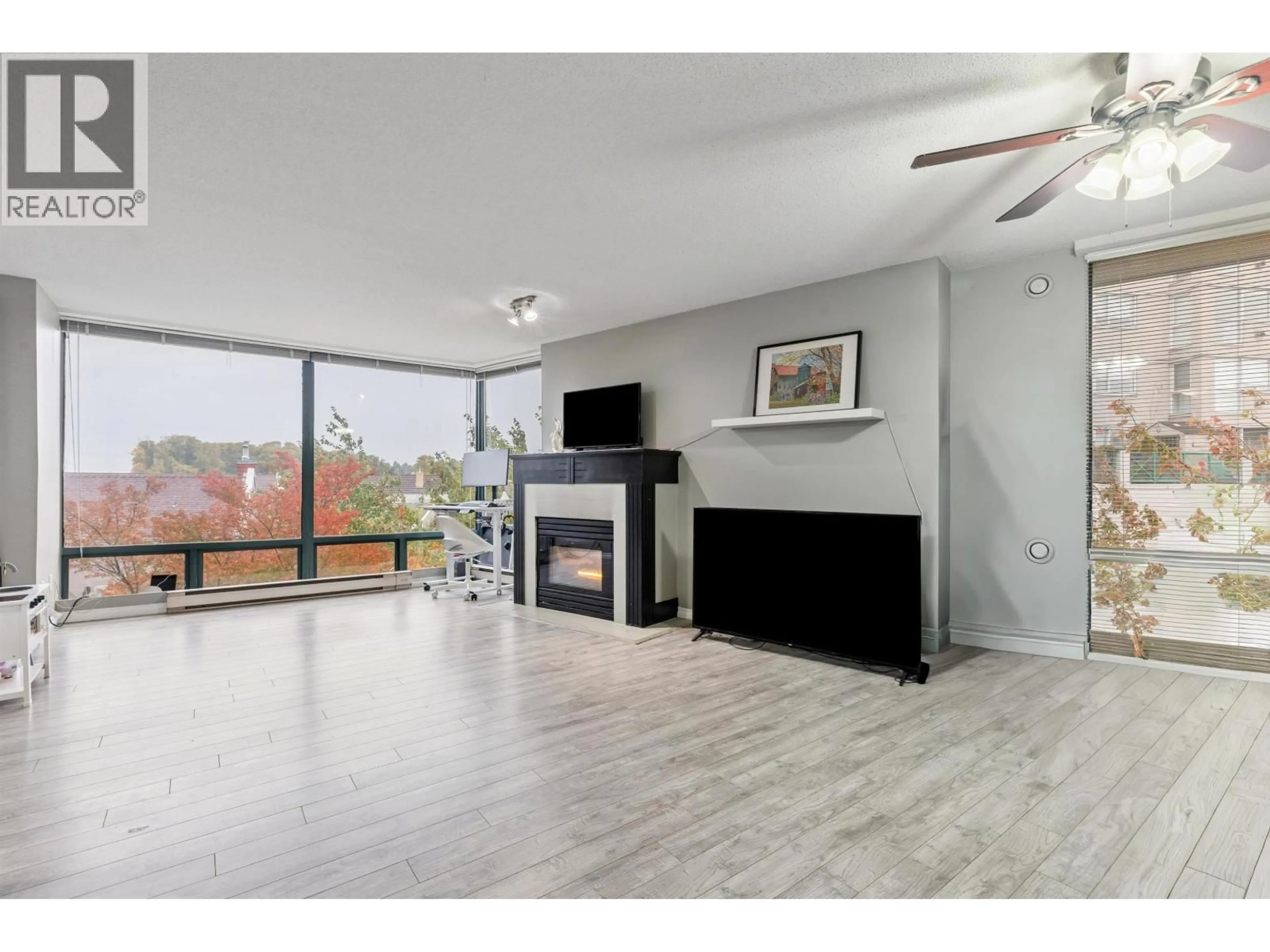 Living room with furniture, wood/laminate floor for 507 - 8 LAGUNA COURT, New Westminster British Columbia V3M6M6