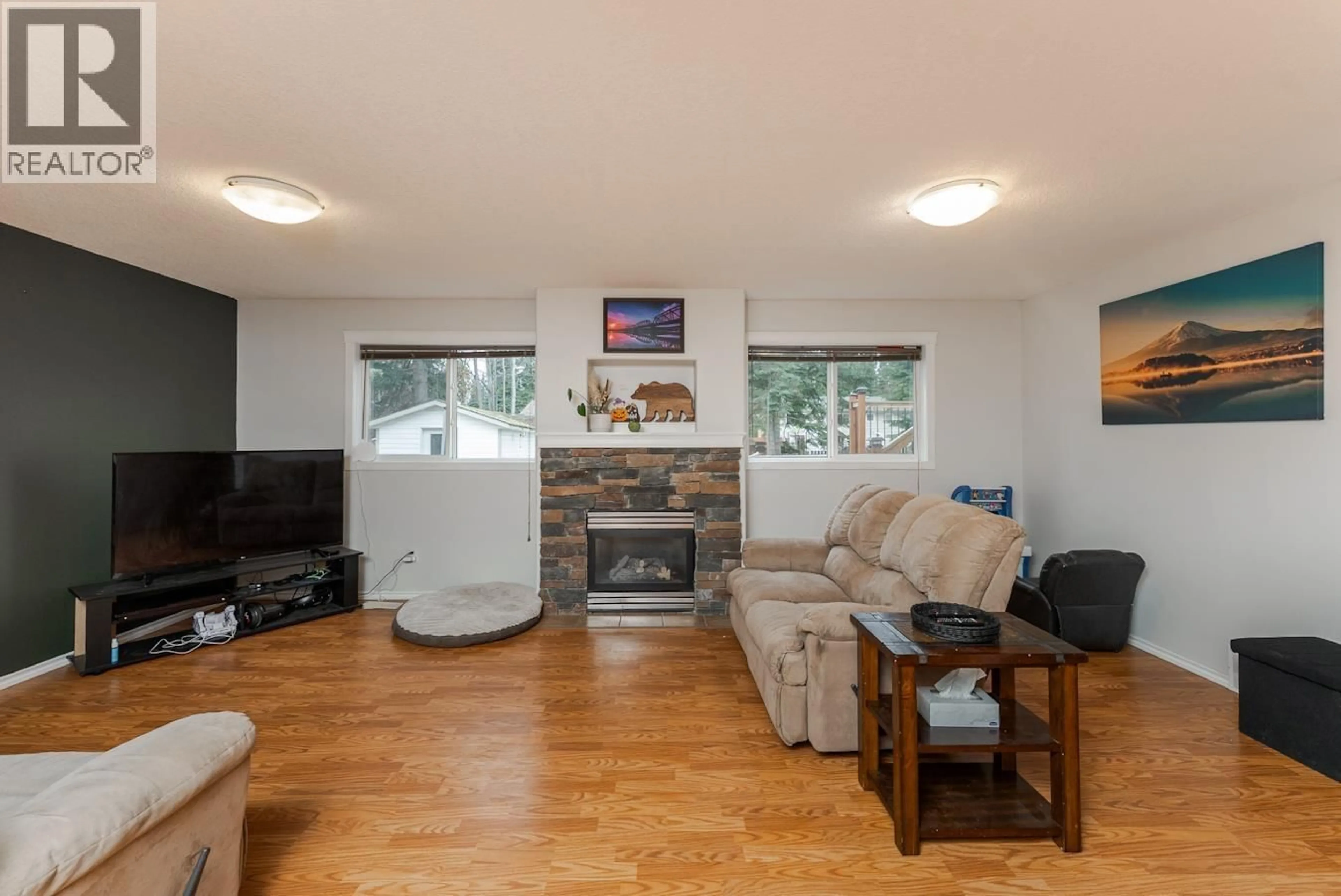 Living room with furniture, wood/laminate floor for 8311 FLAMINGO ROAD, Prince George British Columbia V2K5H2
