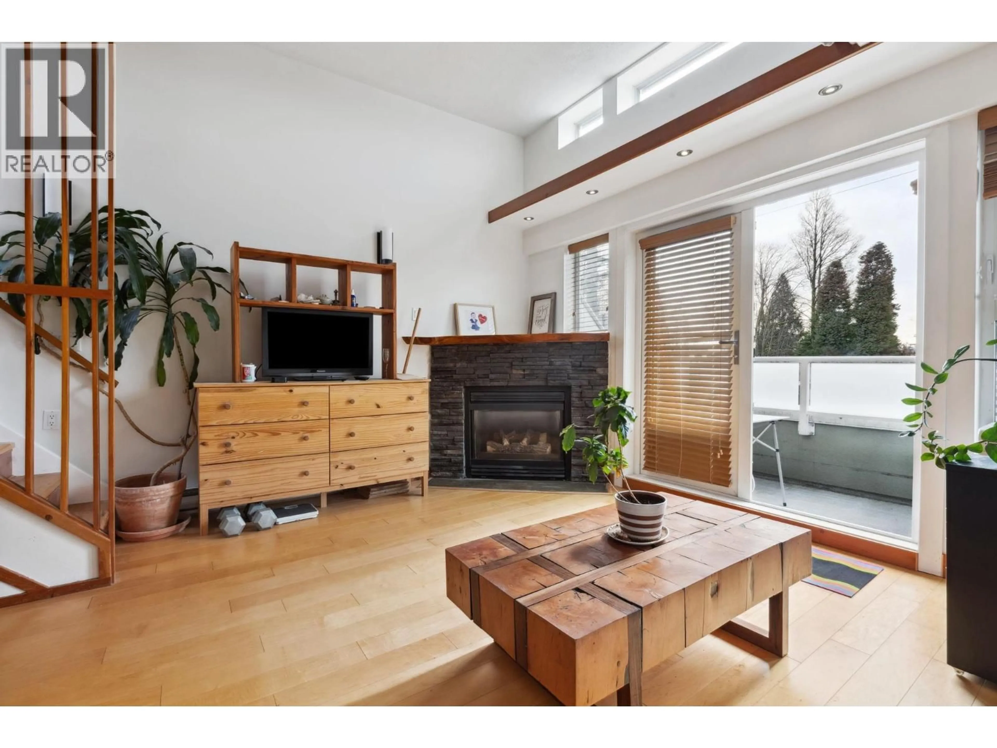 Living room with furniture, wood/laminate floor for 307 - 980 22ND AVENUE, Vancouver British Columbia V5Z2A1