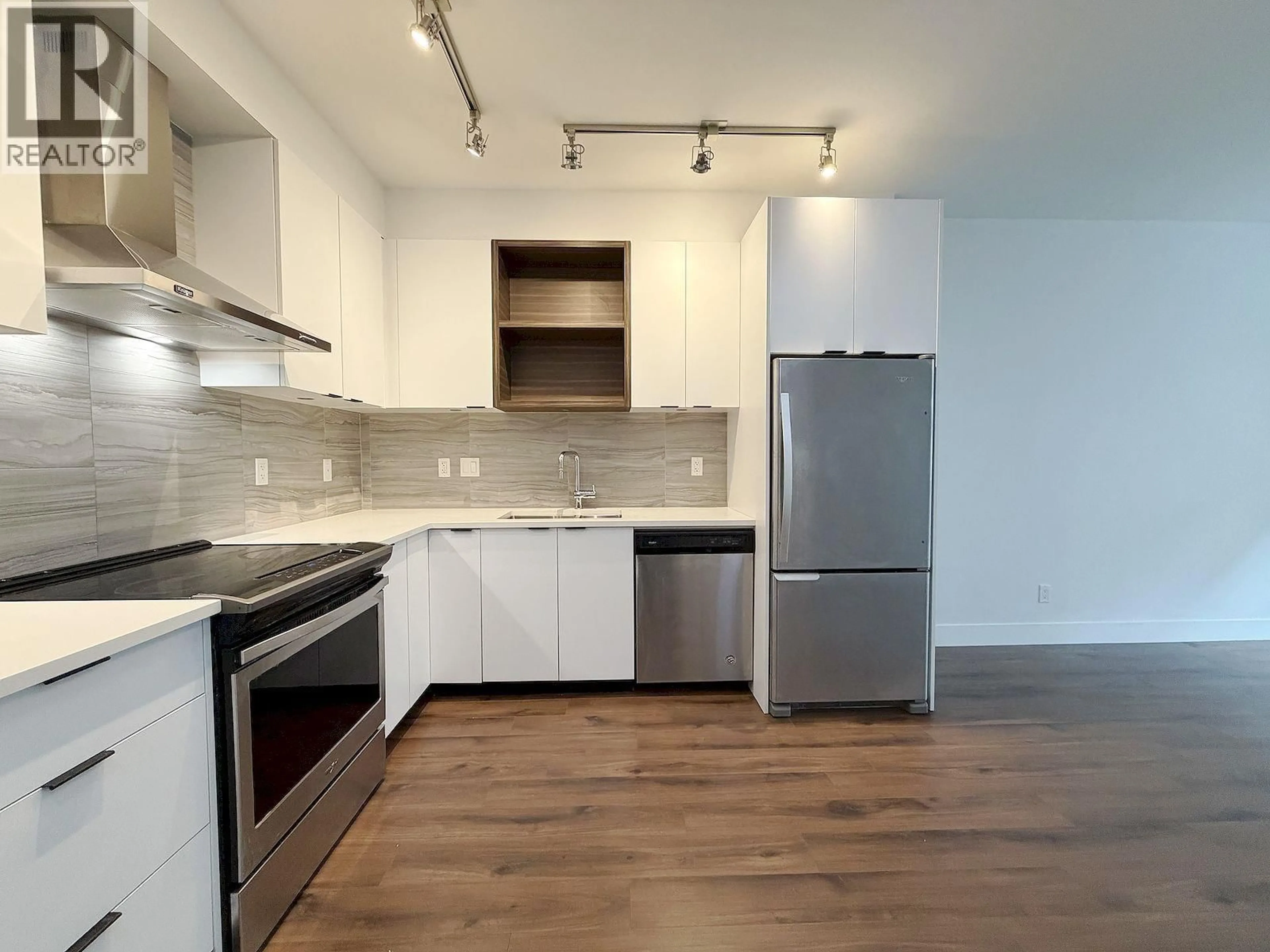 Open concept kitchen, wood/laminate floor for 242 - 5355 LANE STREET, Burnaby British Columbia V5H0H1