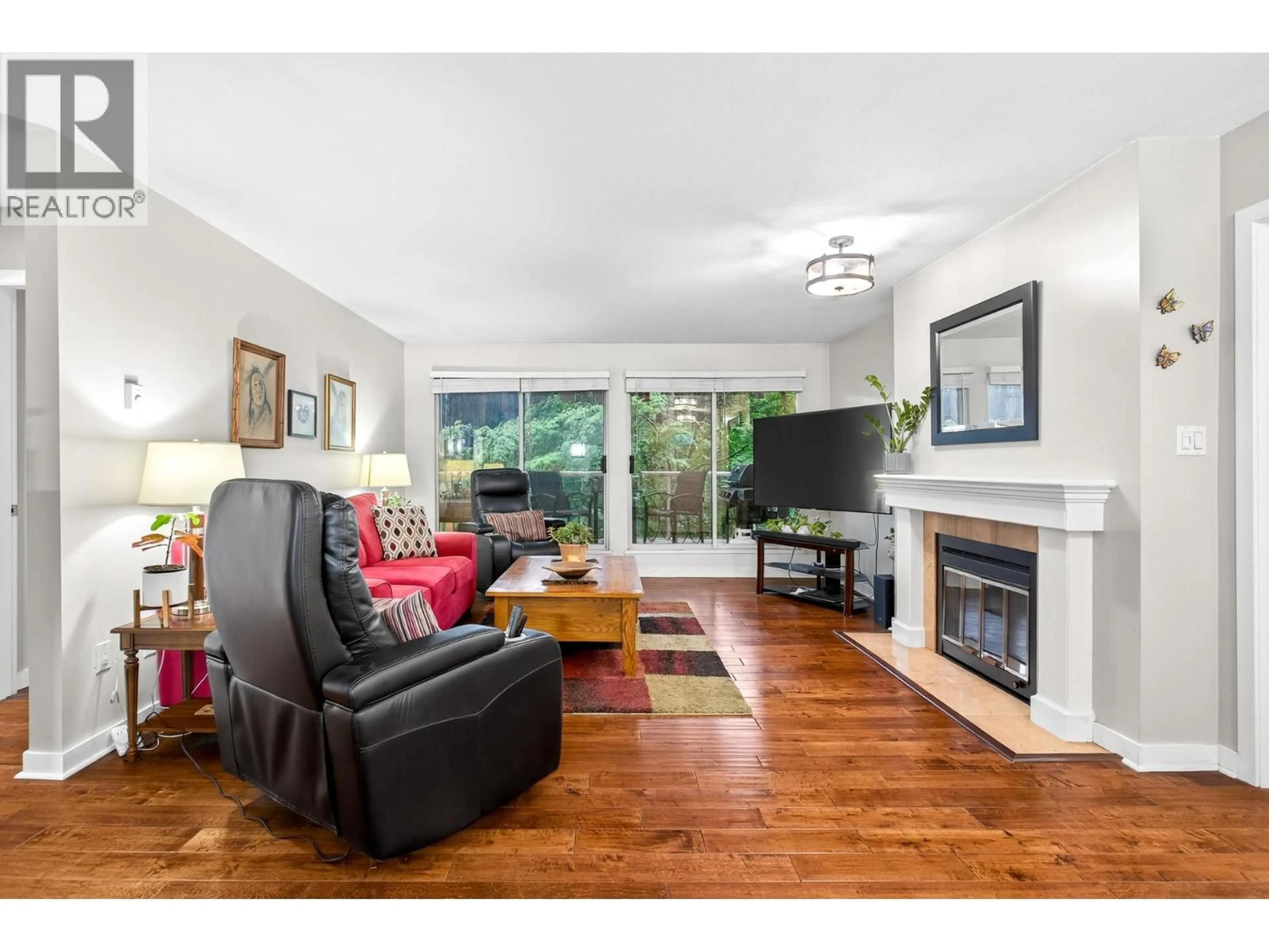 Living room with furniture, wood/laminate floor for 305 - 2733 ATLIN PLACE, Coquitlam British Columbia V3C5B1