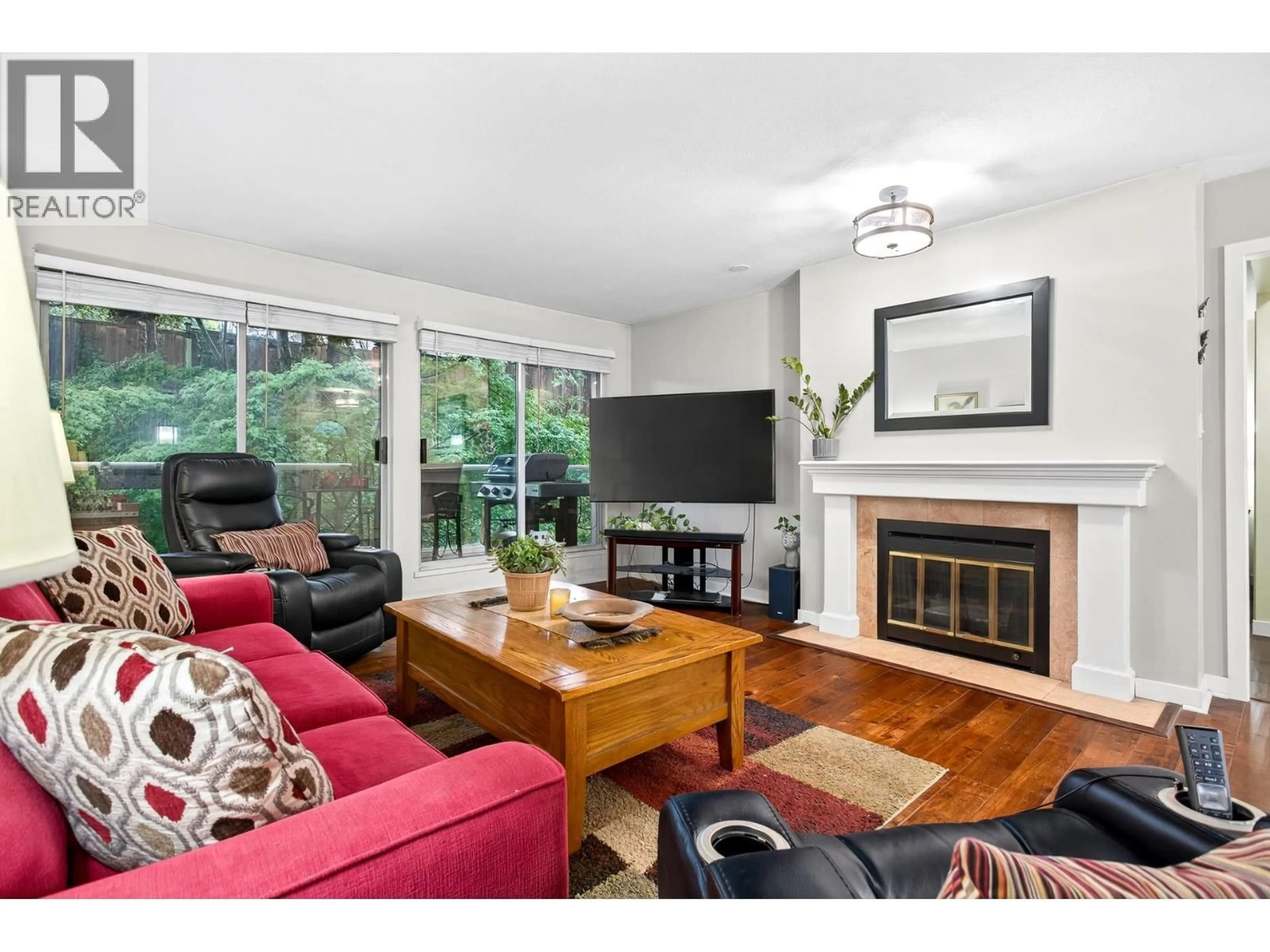 Living room with furniture, wood/laminate floor for 305 - 2733 ATLIN PLACE, Coquitlam British Columbia V3C5B1