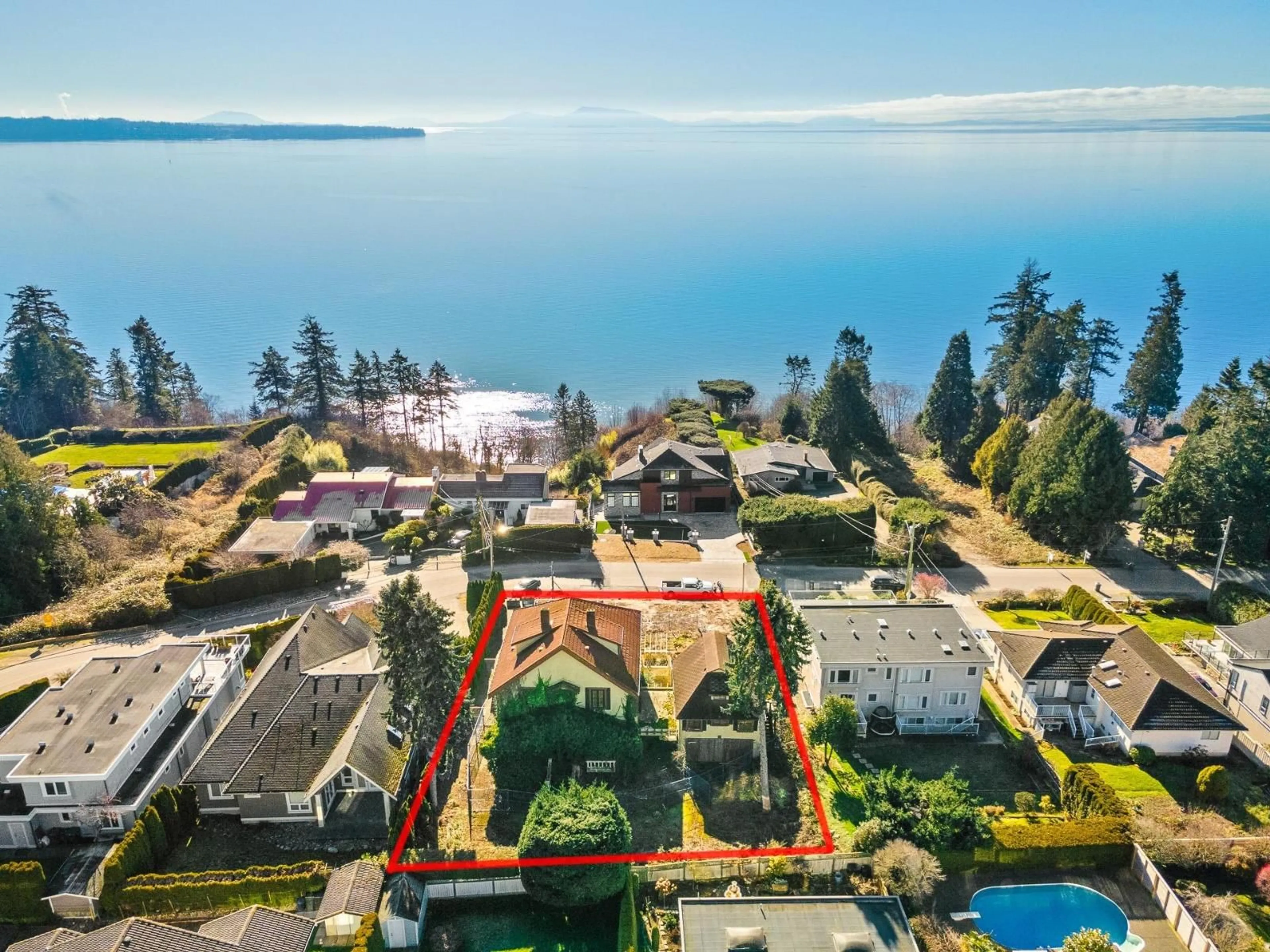 A pic from outside/outdoor area/front of a property/back of a property/a pic from drone, water/lake/river/ocean view for 13567 13A, Surrey British Columbia V4A1C5