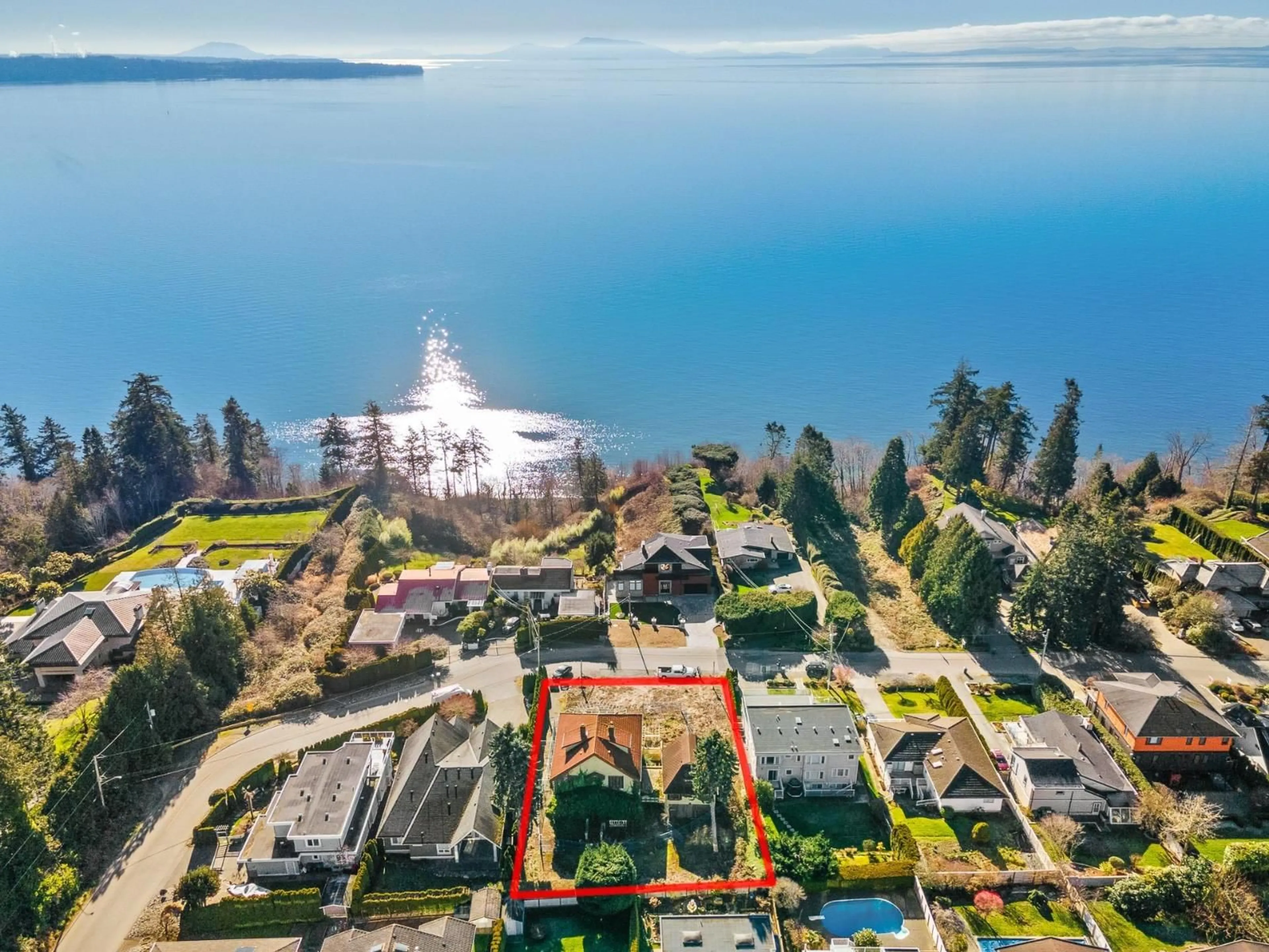 A pic from outside/outdoor area/front of a property/back of a property/a pic from drone, water/lake/river/ocean view for 13567 13A, Surrey British Columbia V4A1C5