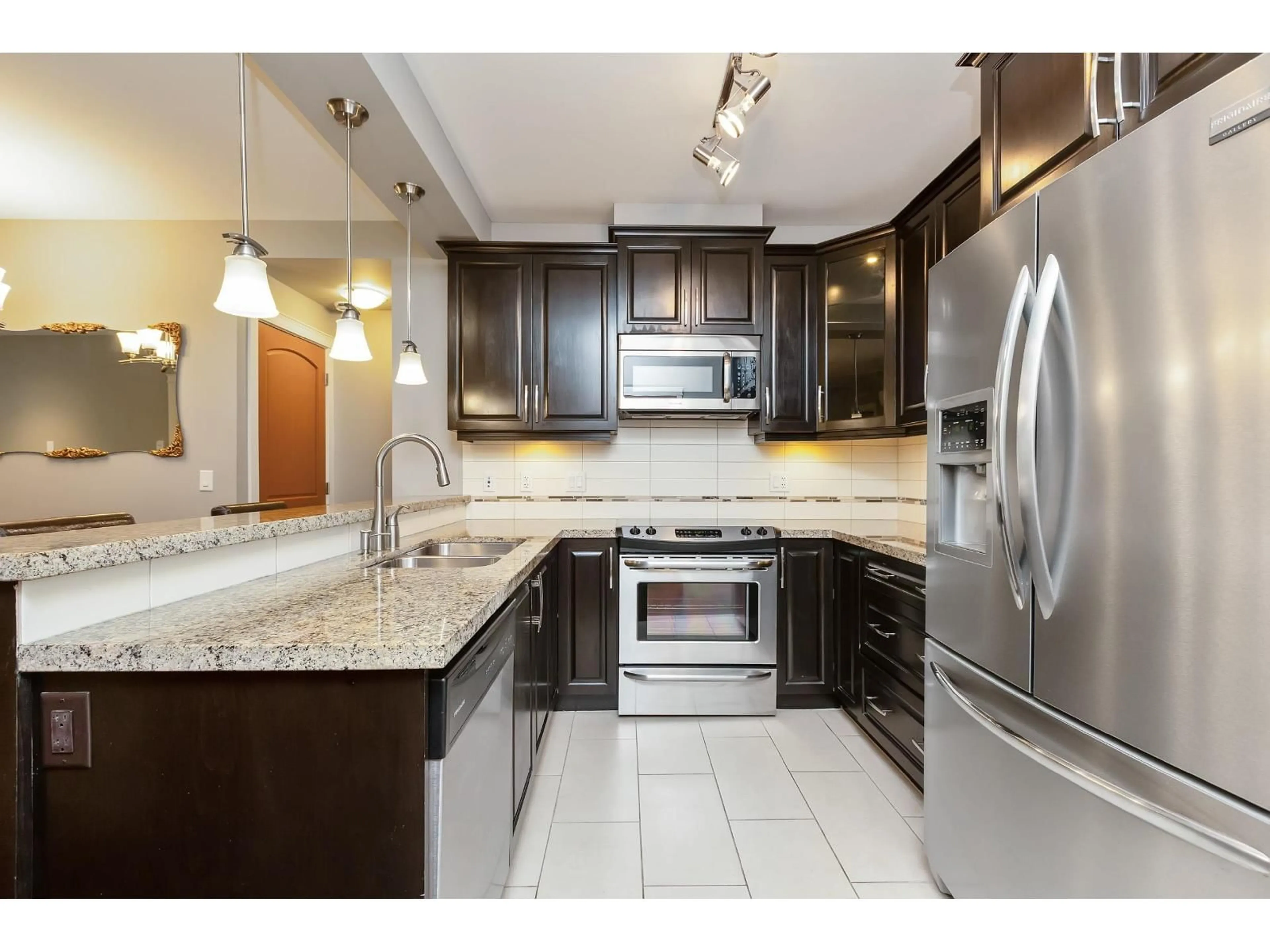Open concept kitchen, ceramic/tile floor for 429 - 8288 207A, Langley British Columbia V2Y0L2