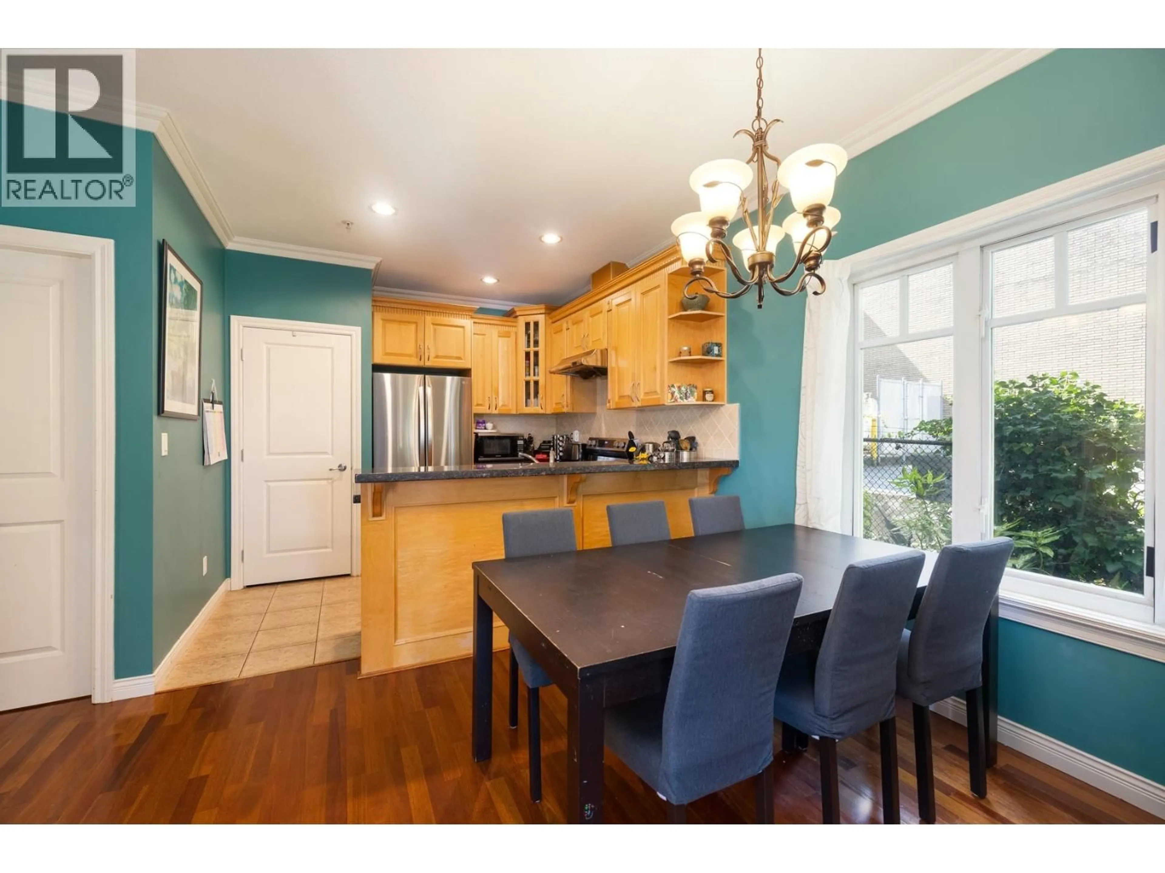 Open concept kitchen, wood/laminate floor for 1930 TURNER STREET, Vancouver British Columbia V5L2A1