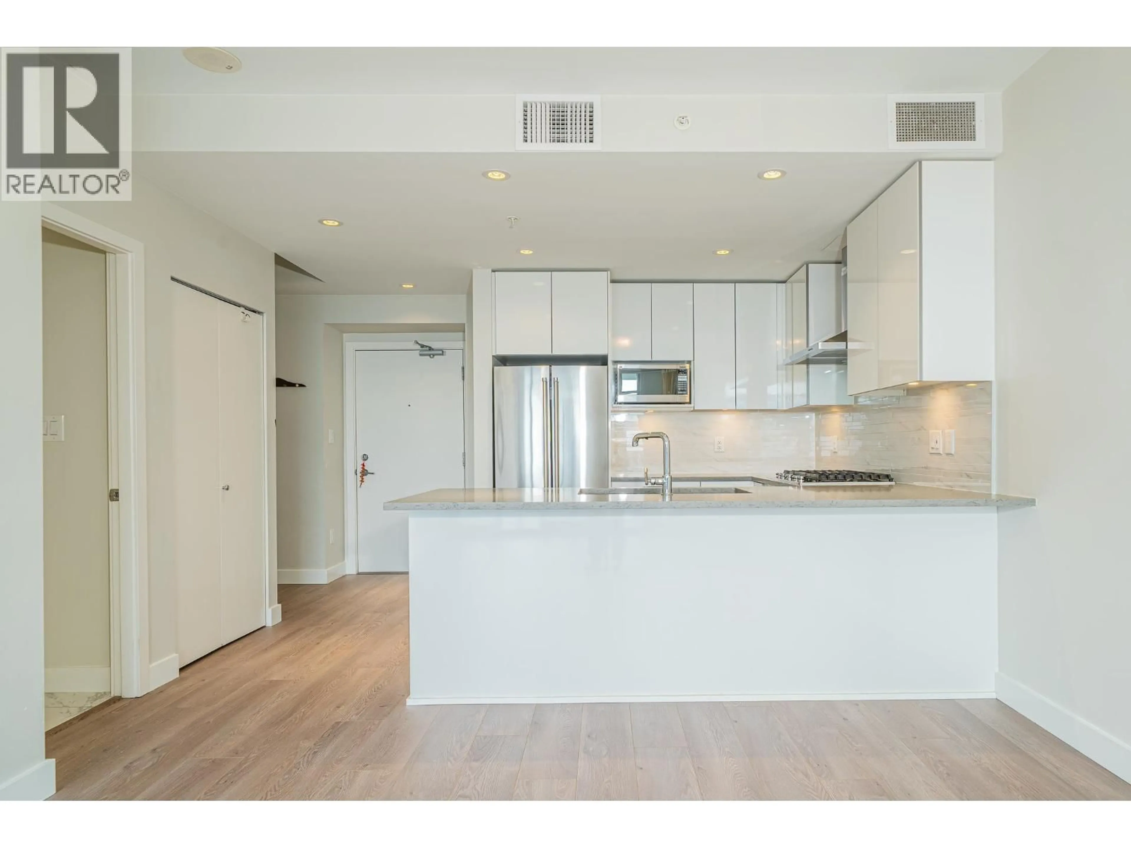 Open concept kitchen, wood/laminate floor for 2601 - 1788 GILMORE AVENUE, Burnaby British Columbia V5C0L5
