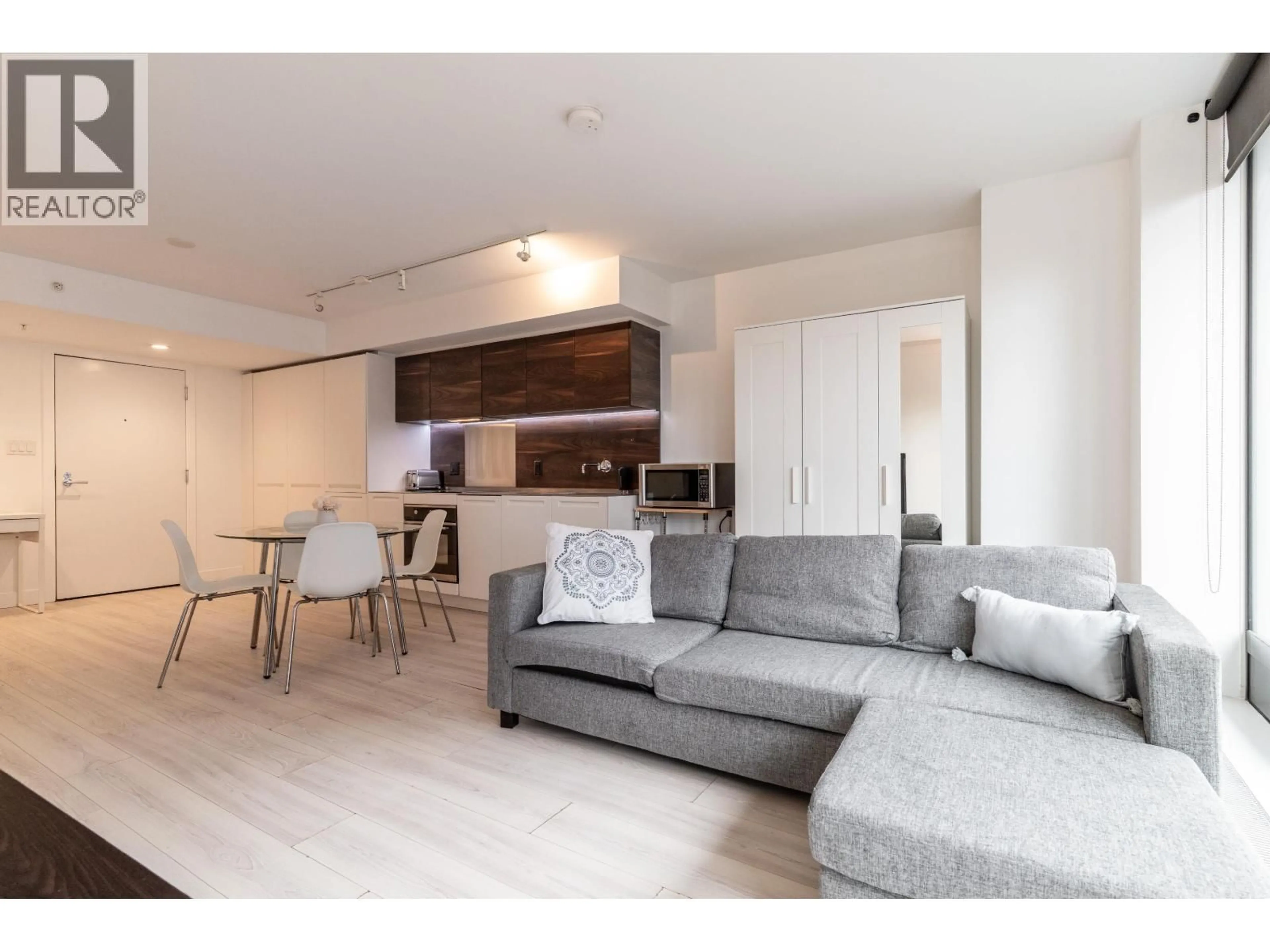 Living room with furniture, wood/laminate floor for 1305 - 1133 HORNBY STREET, Vancouver British Columbia V6Z1W1