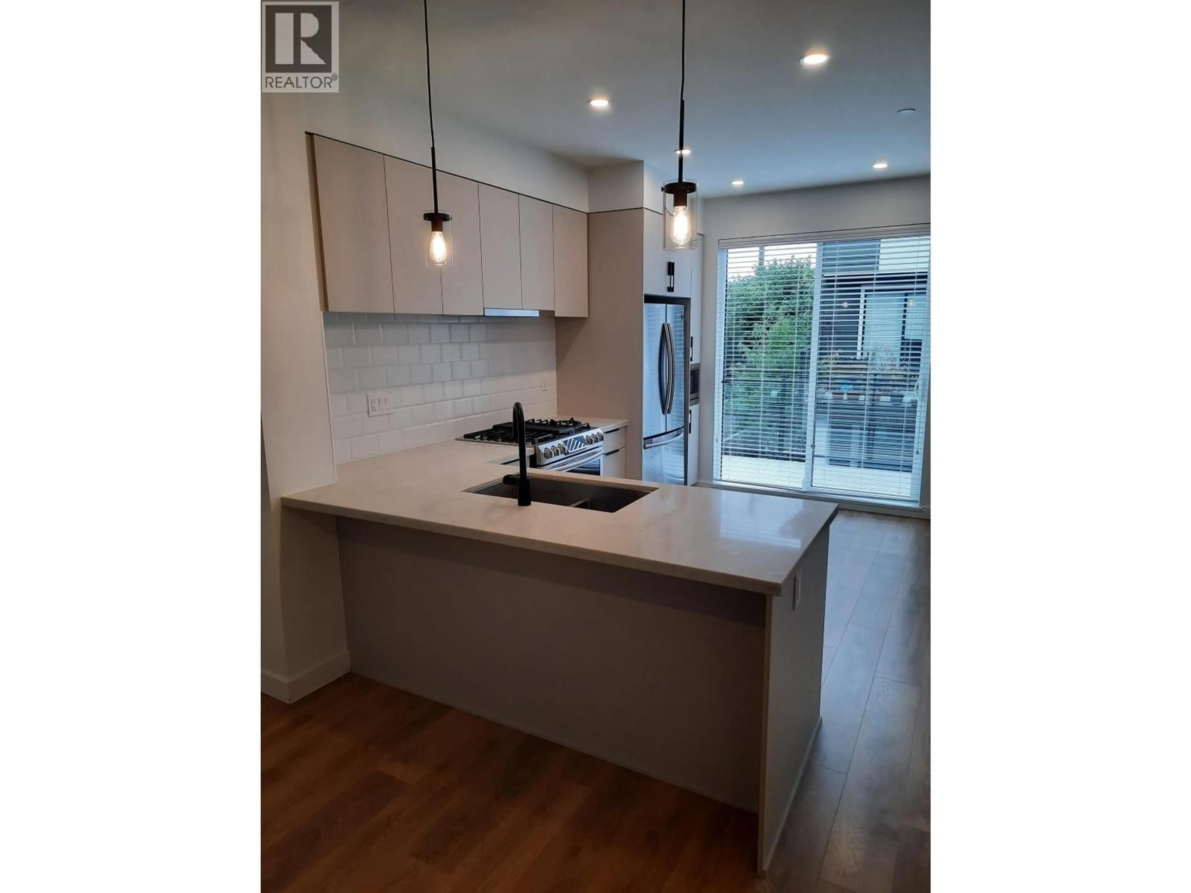Open concept kitchen, wood/laminate floor for 601 - 3021 ST GEORGE STREET, Port Moody British Columbia V3H0K3