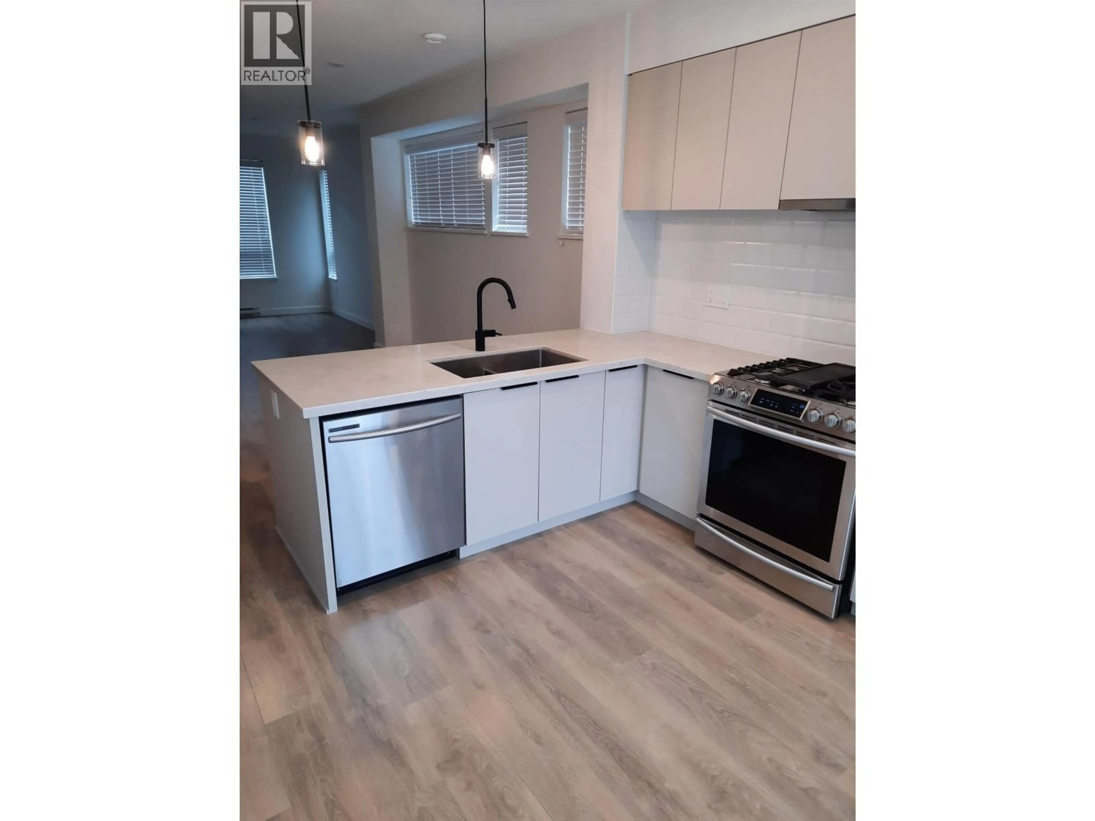 Open concept kitchen, wood/laminate floor for 601 - 3021 ST GEORGE STREET, Port Moody British Columbia V3H0K3