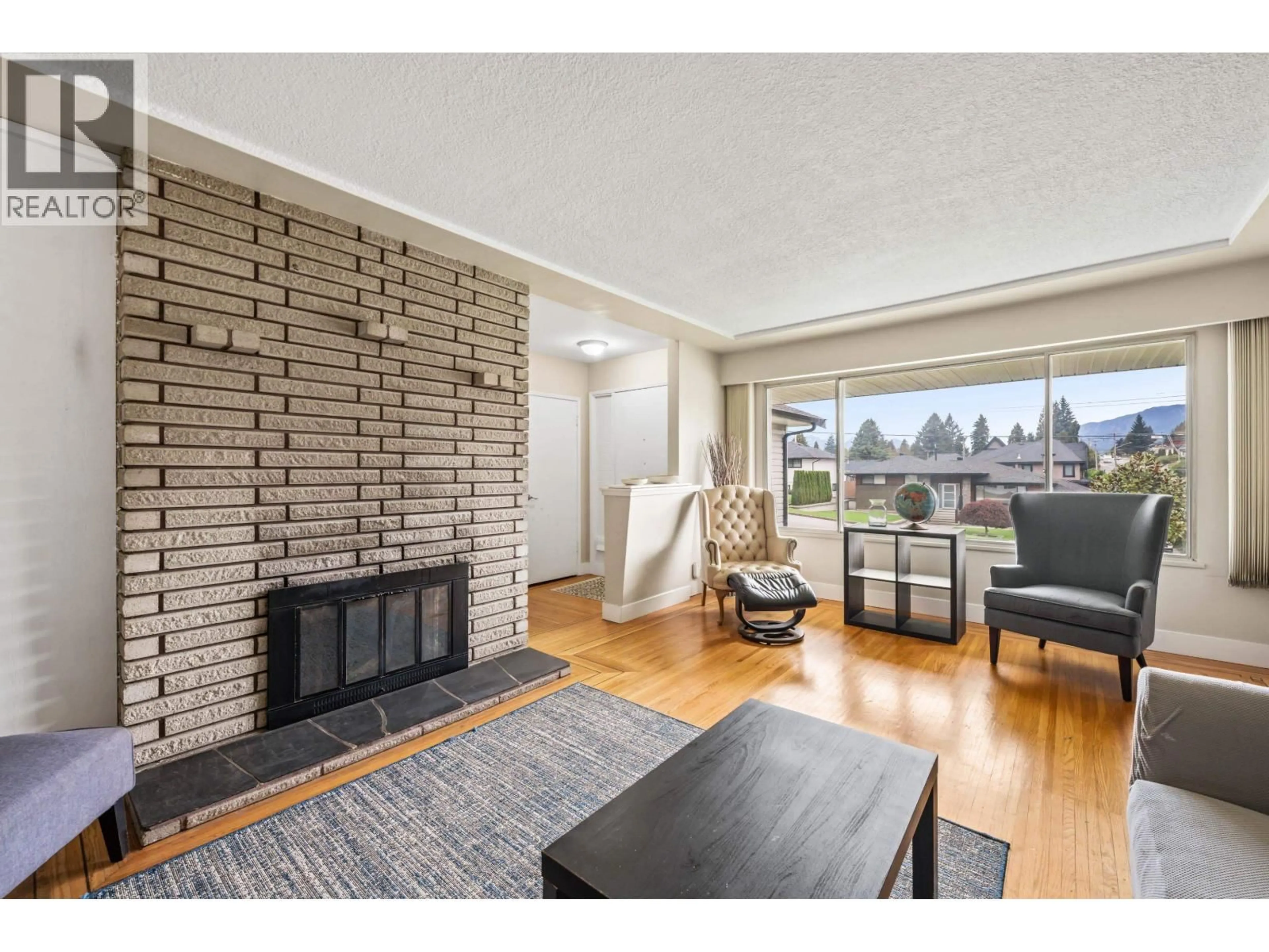 Living room with furniture, wood/laminate floor for 1698 SPRICE AVENUE, Coquitlam British Columbia V3J2P6