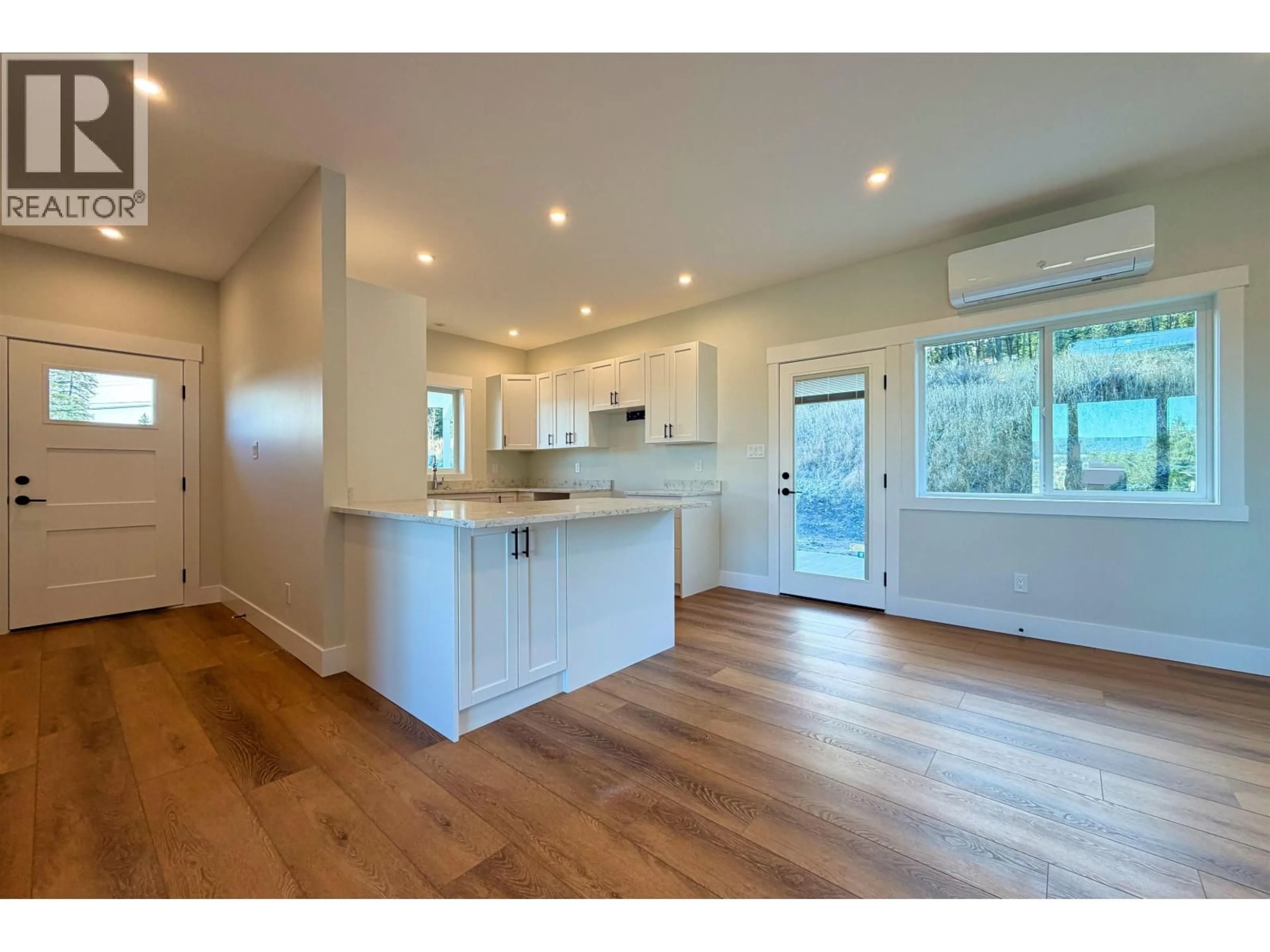 Open concept kitchen, wood/laminate floor for 18 - 555 WOTZKE DRIVE, Williams Lake British Columbia V2G4K2