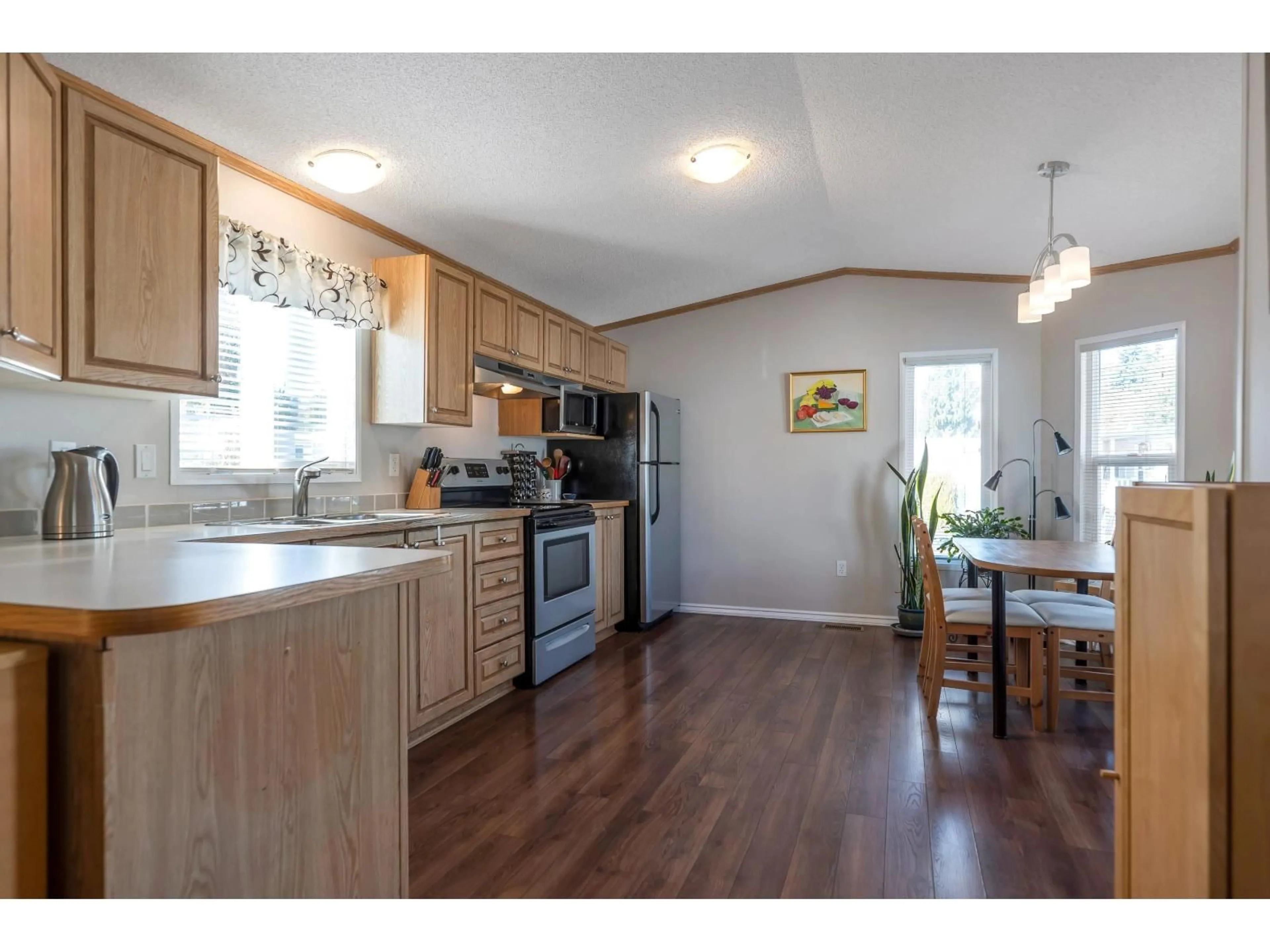 Open concept kitchen, wood/laminate floor for 169 - 1840 160, Surrey British Columbia V4A4X4