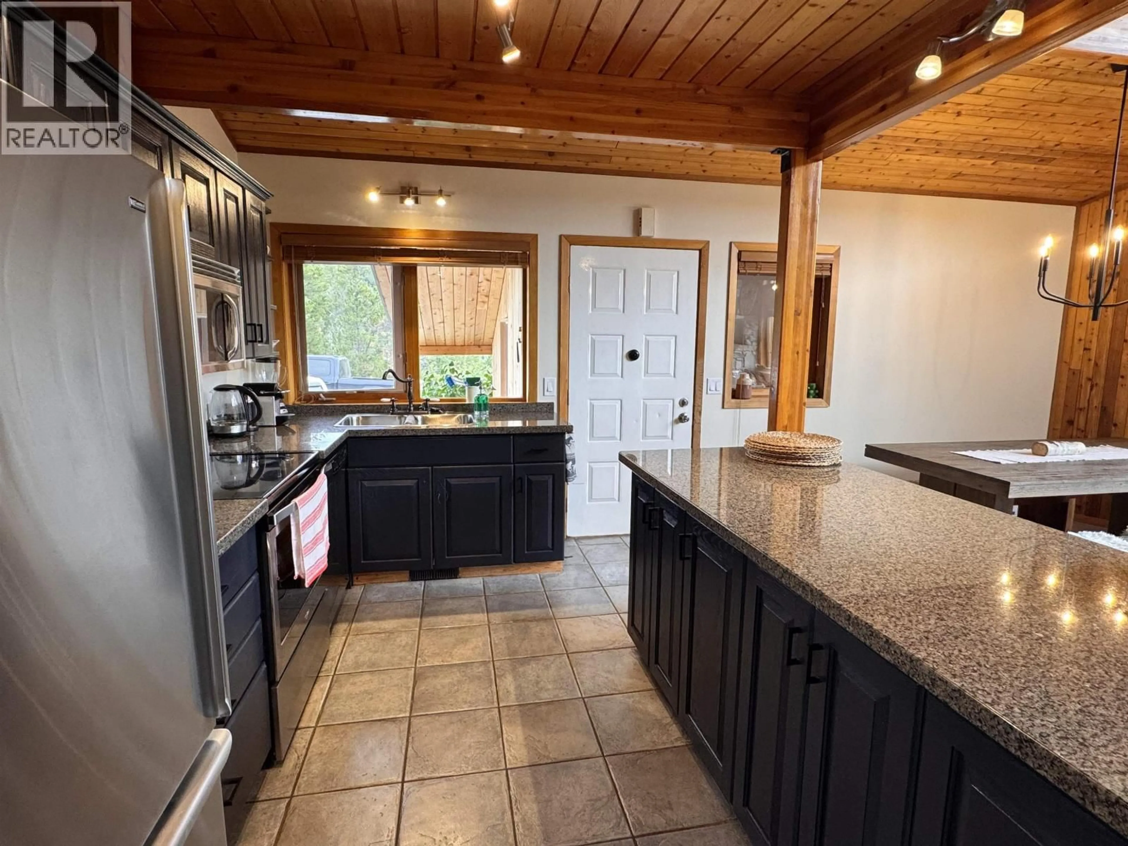 Open concept kitchen, ceramic/tile floor for 6796 TATLAYOKO ROAD, Chilcotin British Columbia V0L1W0