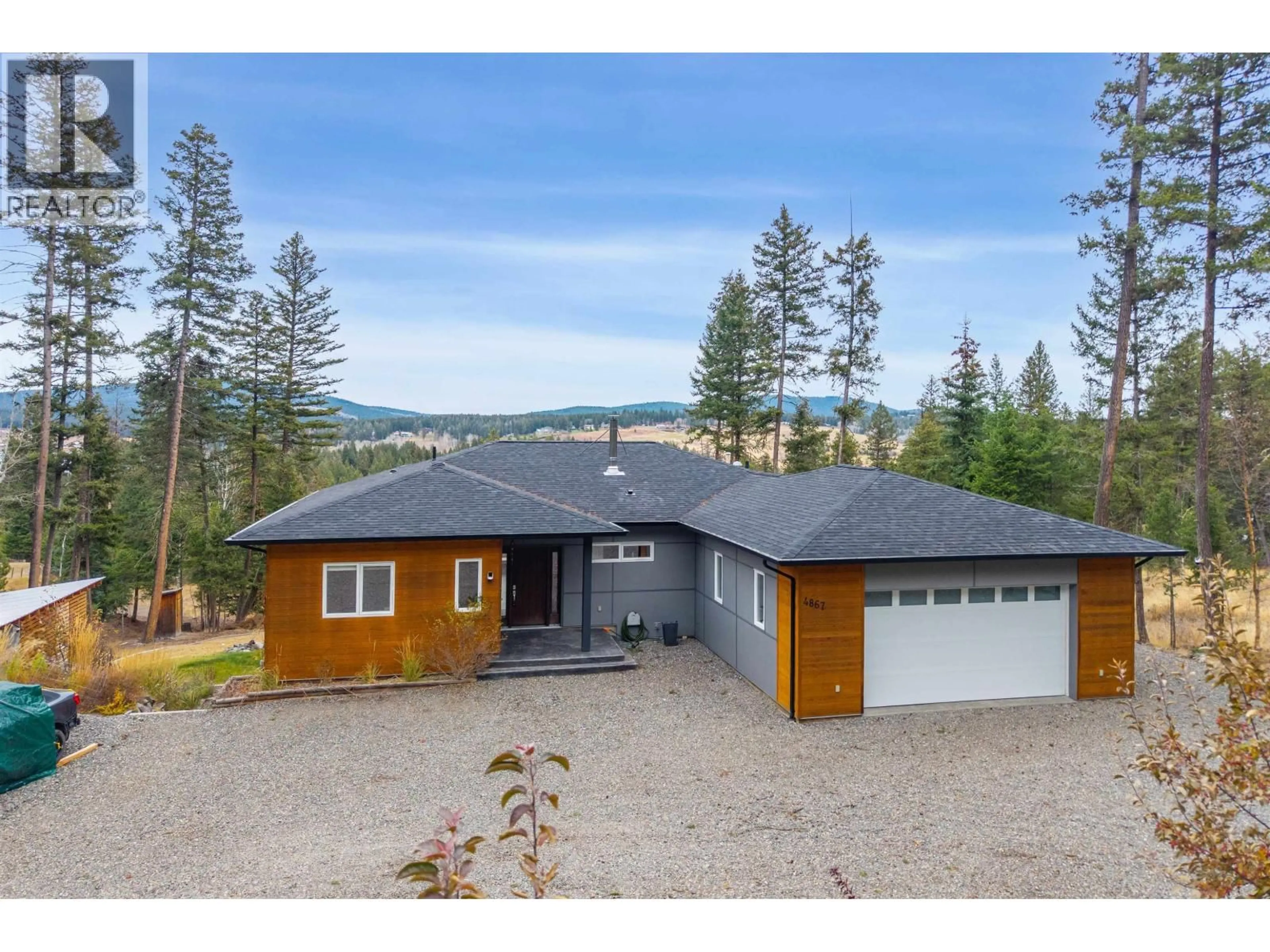 A pic from outside/outdoor area/front of a property/back of a property/a pic from drone, mountain view for 4867 TATTERSFIELD PLACE, 108 Mile Ranch British Columbia V0K2Z0