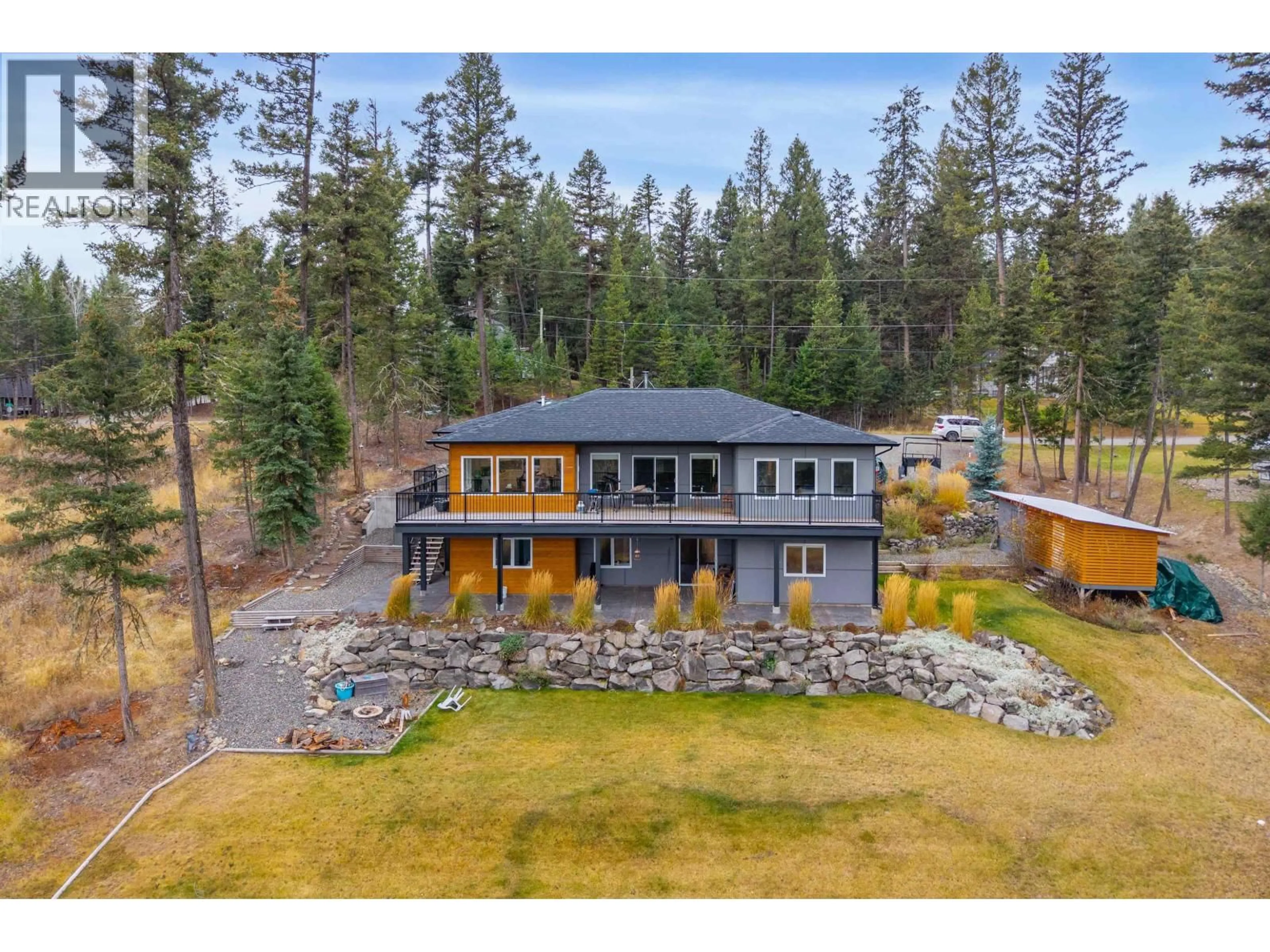 A pic from outside/outdoor area/front of a property/back of a property/a pic from drone, mountain view for 4867 TATTERSFIELD PLACE, 108 Mile Ranch British Columbia V0K2Z0