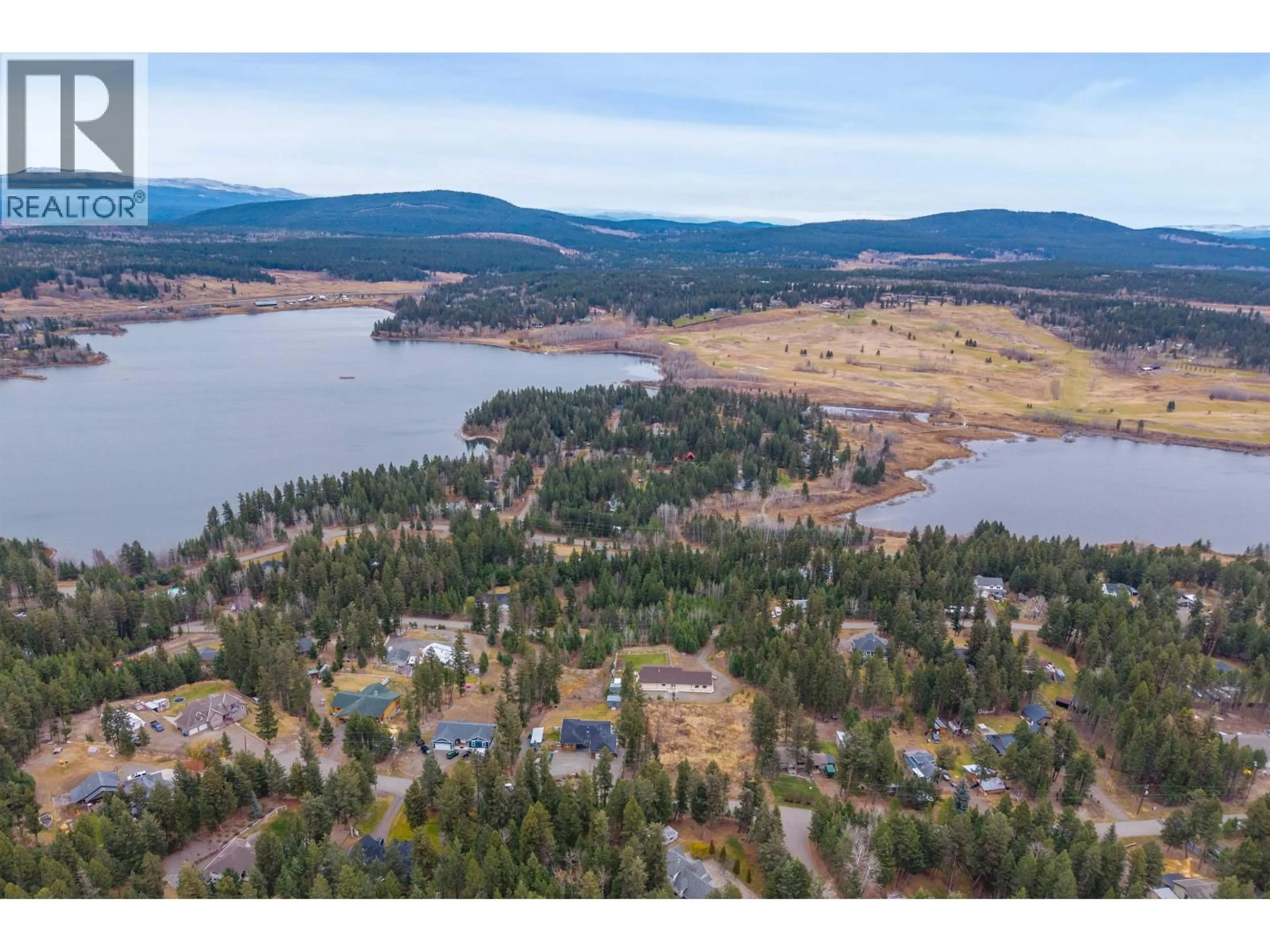 A pic from outside/outdoor area/front of a property/back of a property/a pic from drone, water/lake/river/ocean view for 4867 TATTERSFIELD PLACE, 108 Mile Ranch British Columbia V0K2Z0