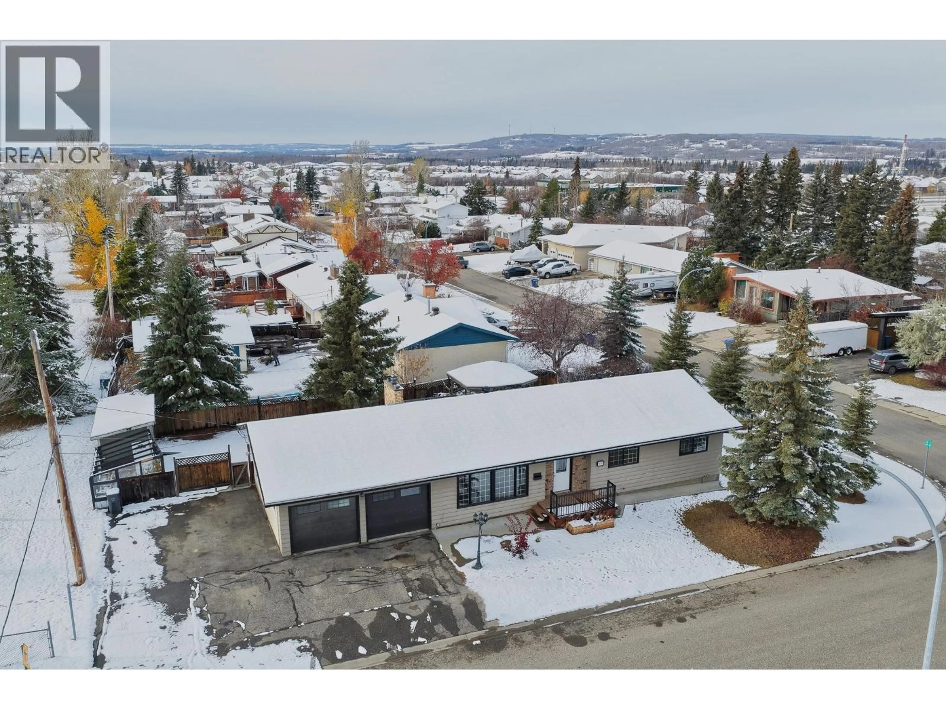 A pic from outside/outdoor area/front of a property/back of a property/a pic from drone, mountain view for 11324 94 STREET, Fort St. John British Columbia V1J3M2