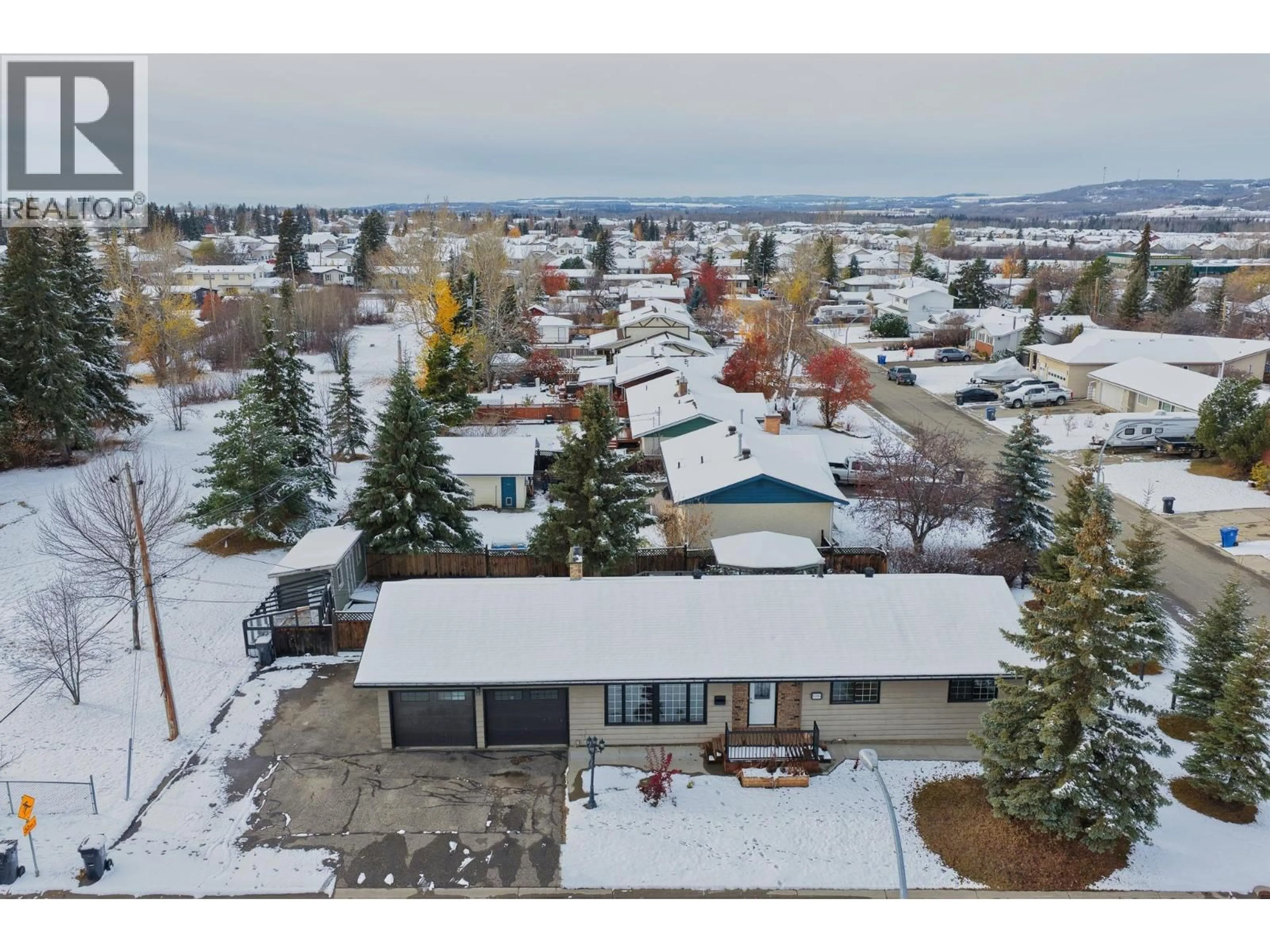 A pic from outside/outdoor area/front of a property/back of a property/a pic from drone, mountain view for 11324 94 STREET, Fort St. John British Columbia V1J3M2