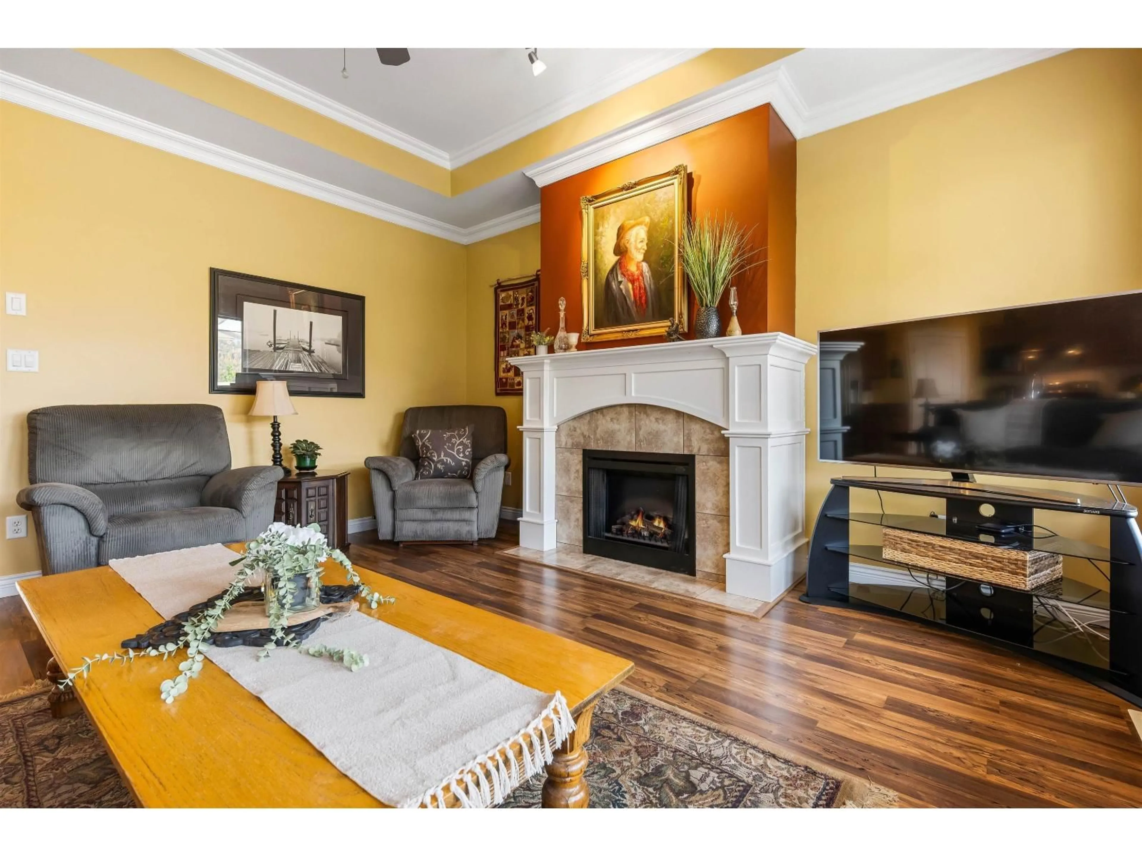 Living room with furniture, wood/laminate floor for 5958 COBBLESTONE STREET, Chilliwack British Columbia V2R0E4