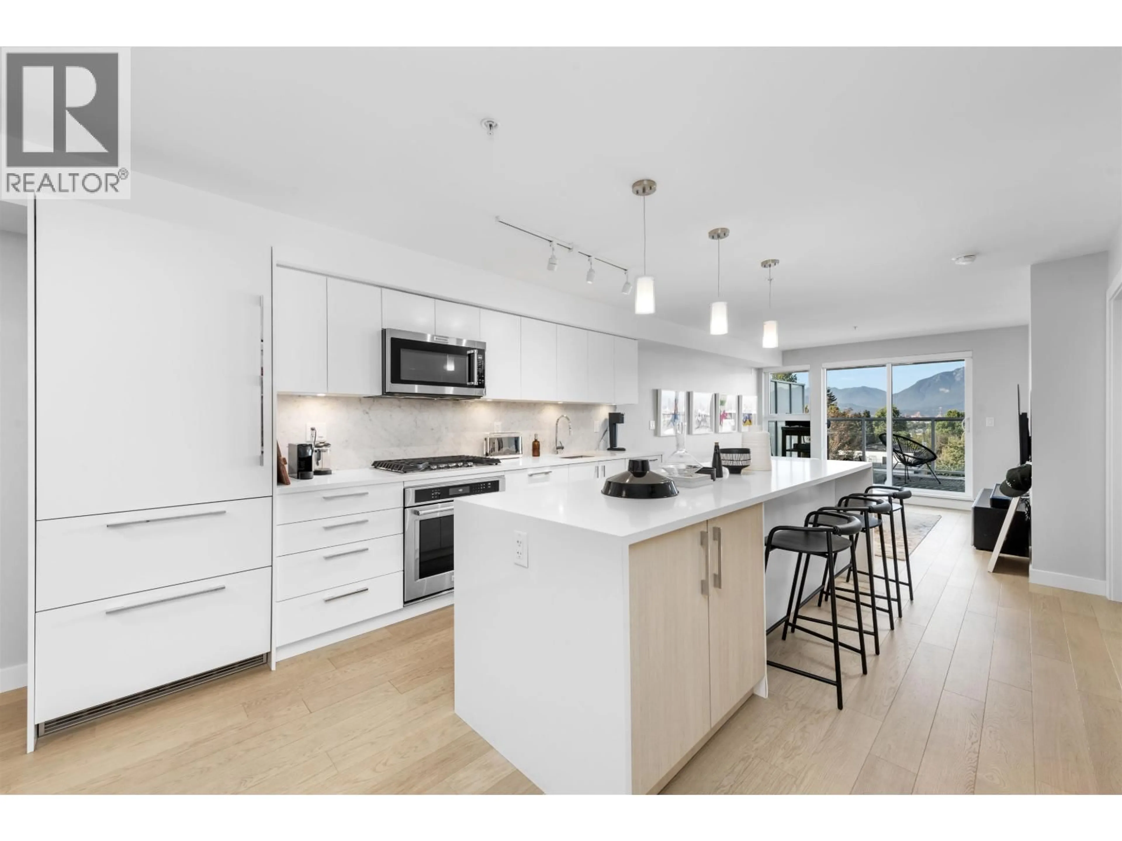 Open concept kitchen, unknown for 406 - 2508 FRASER STREET, Vancouver British Columbia V5T3V4