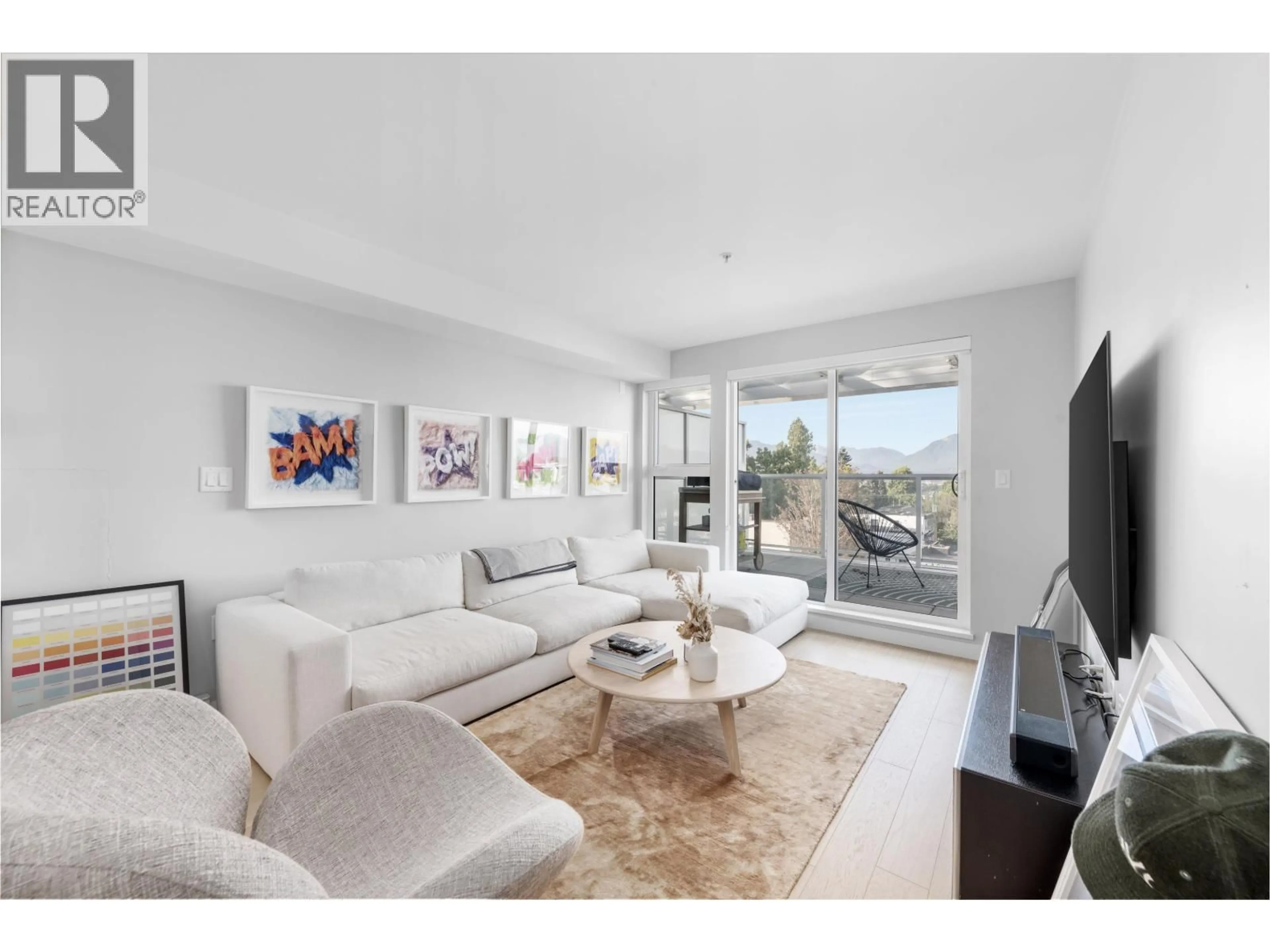 Living room with furniture, unknown for 406 - 2508 FRASER STREET, Vancouver British Columbia V5T3V4