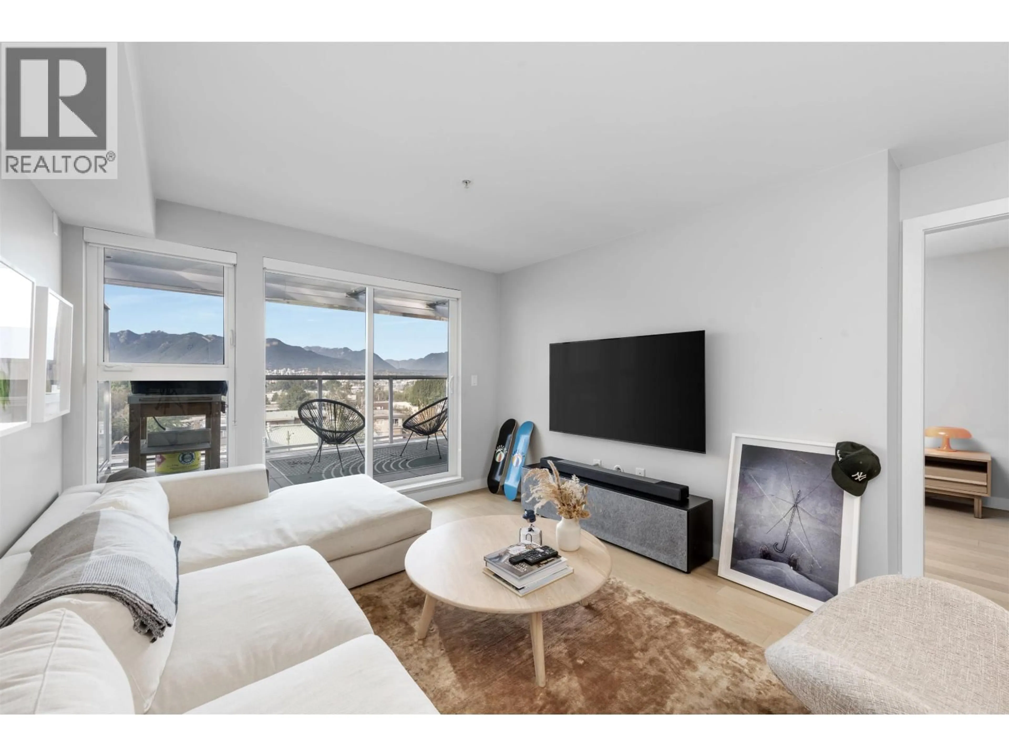 Living room with furniture, unknown for 406 - 2508 FRASER STREET, Vancouver British Columbia V5T3V4