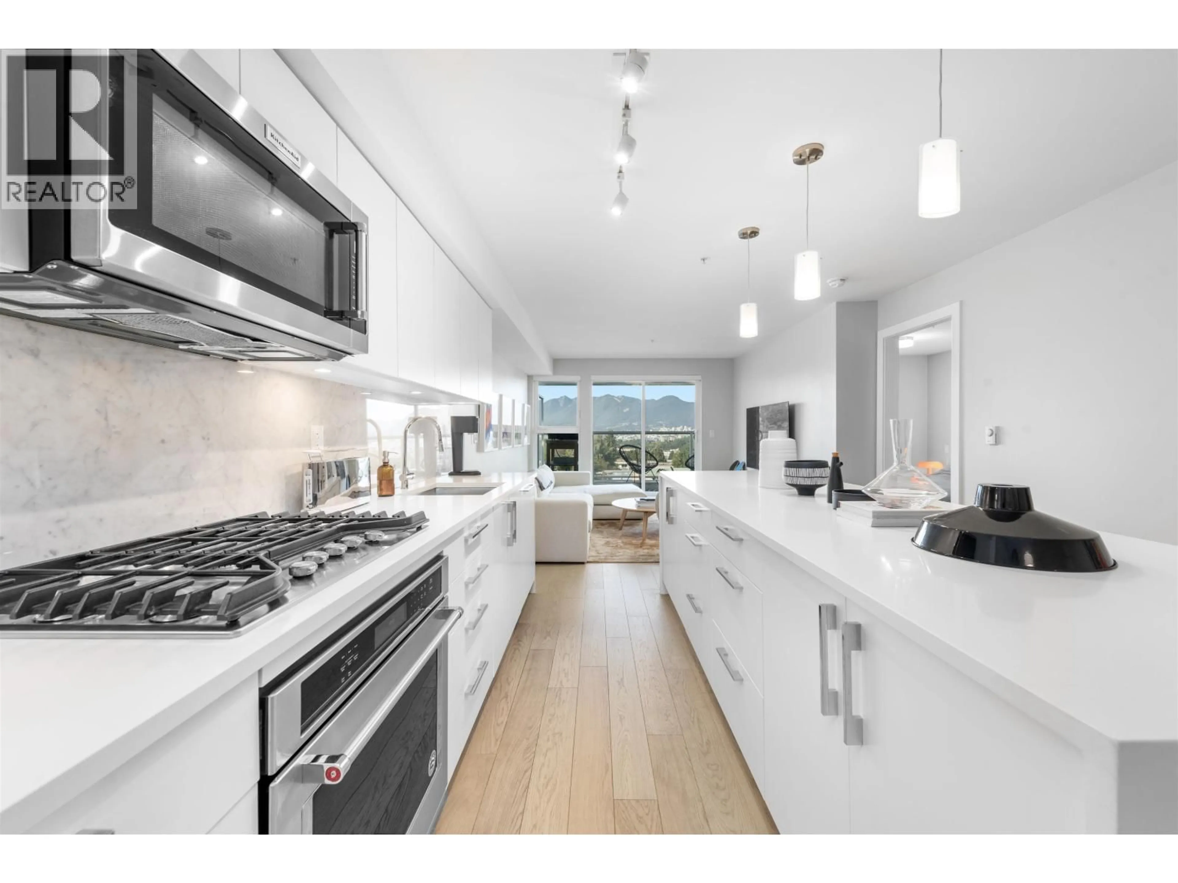 Open concept kitchen, unknown for 406 - 2508 FRASER STREET, Vancouver British Columbia V5T3V4