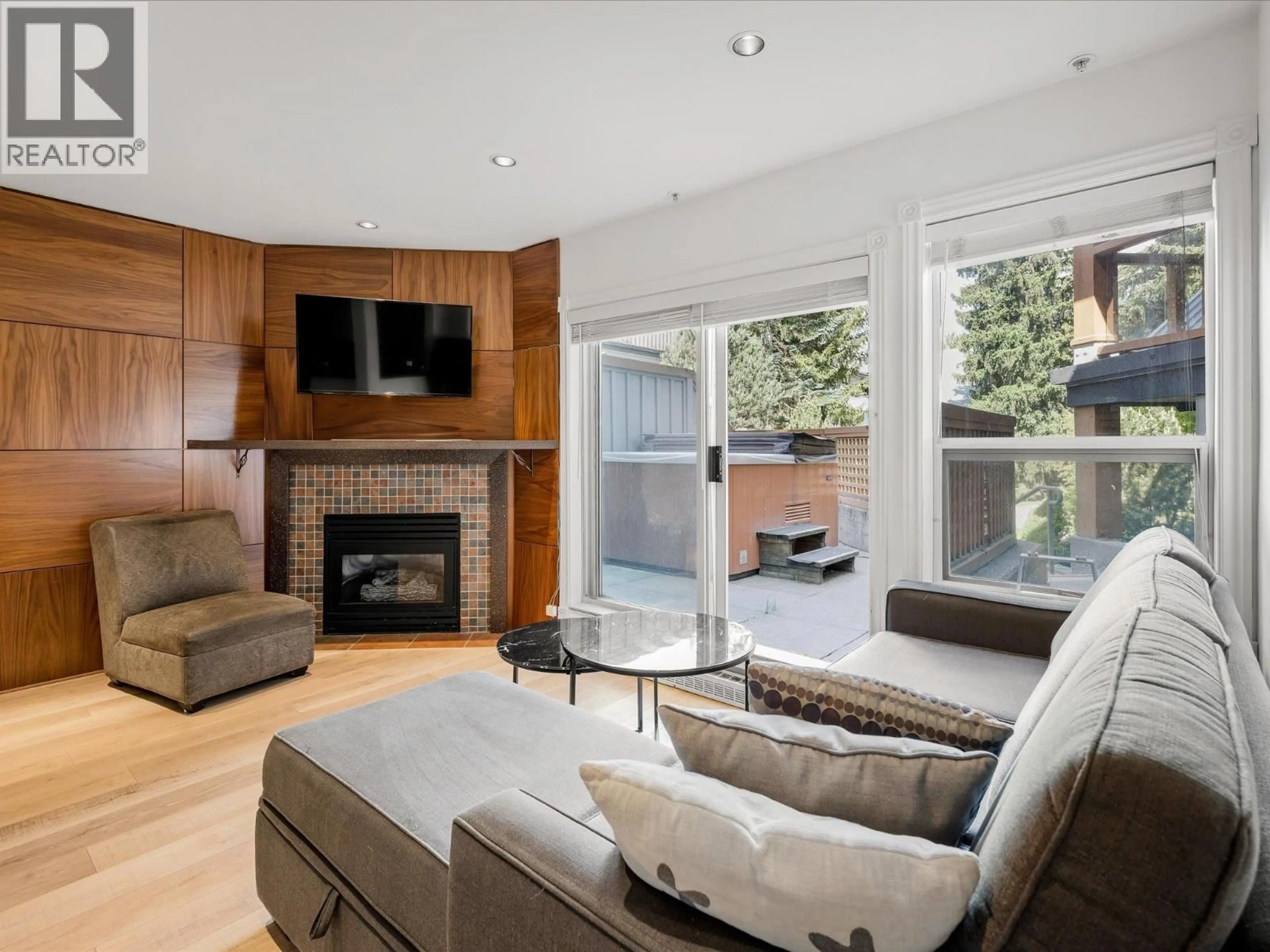 Living room with furniture, wood/laminate floor for 98 - 4388 NORTHLANDS BOULEVARD, Whistler British Columbia V8E1C6