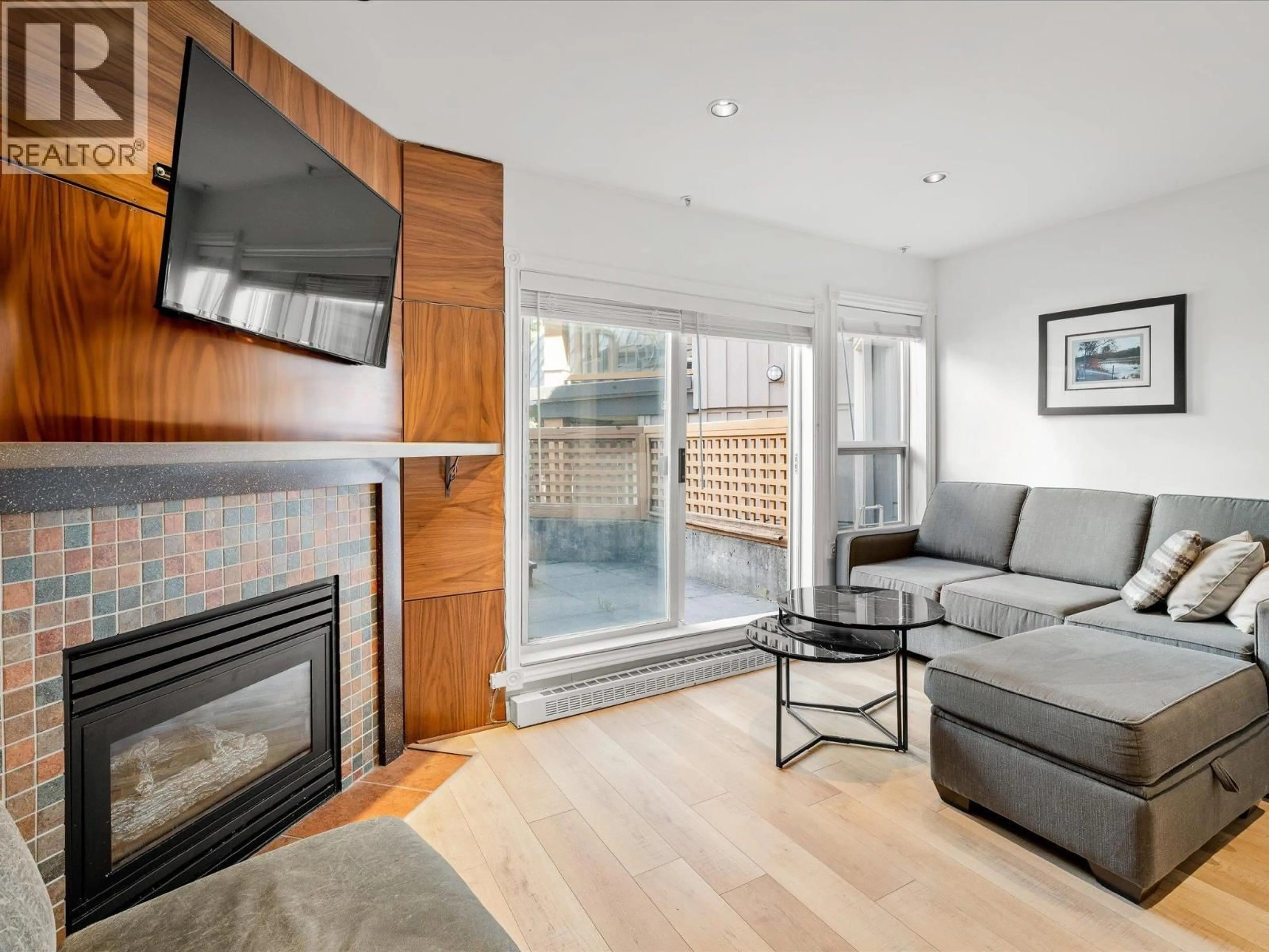 Living room with furniture, wood/laminate floor for 98 - 4388 NORTHLANDS BOULEVARD, Whistler British Columbia V8E1C6