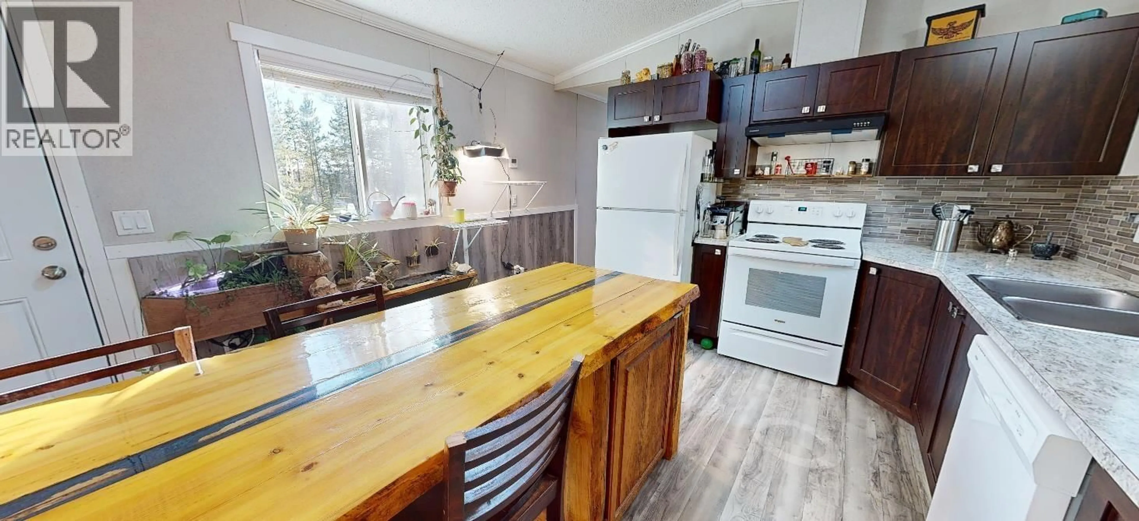 Open concept kitchen, wood/laminate floor for 4591 MATTHEWS ROAD, Quesnel British Columbia V2J6V4