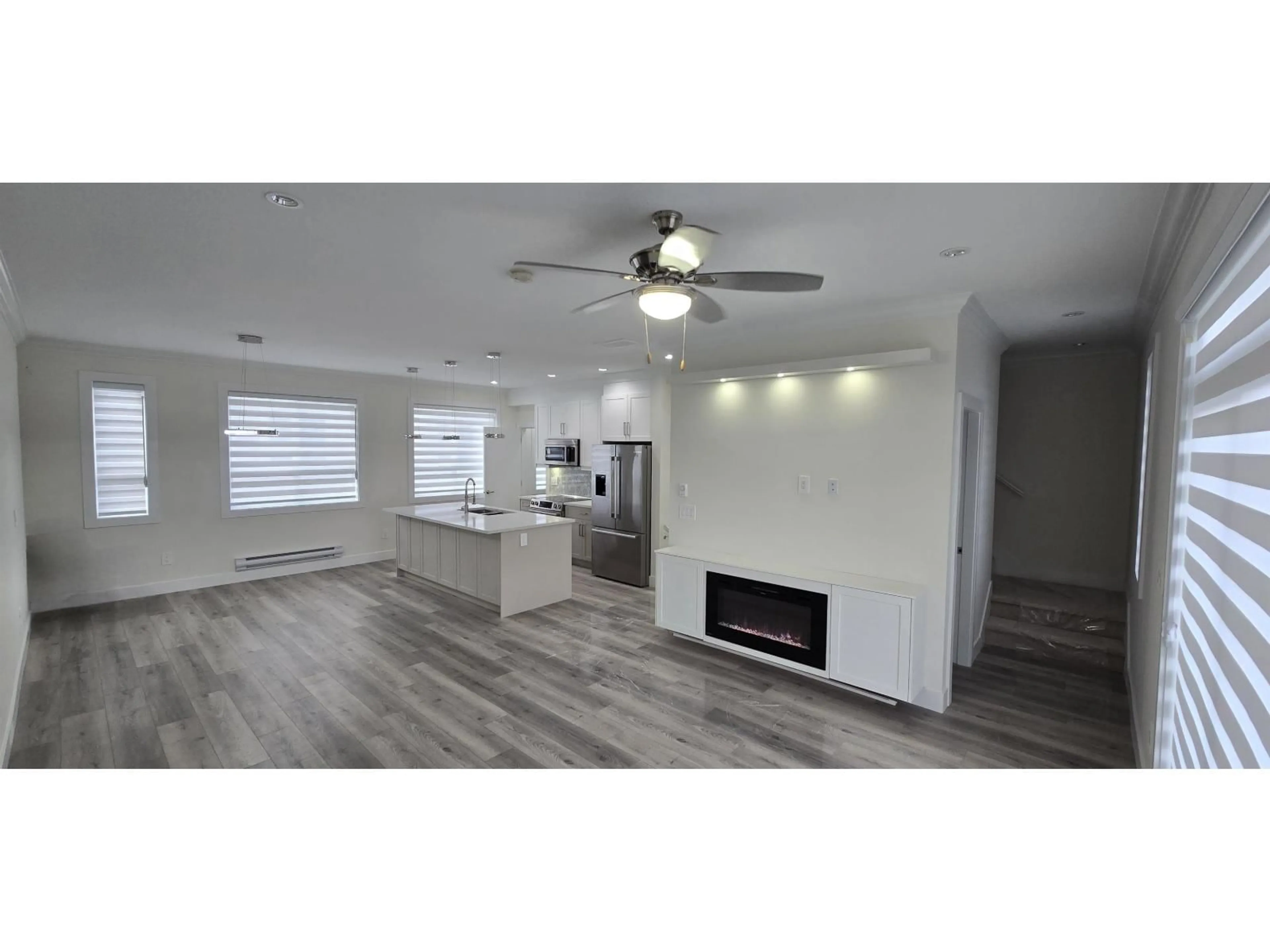 Open concept kitchen, wood/laminate floor for 11 - 8181 135A, Surrey British Columbia V3W3N8