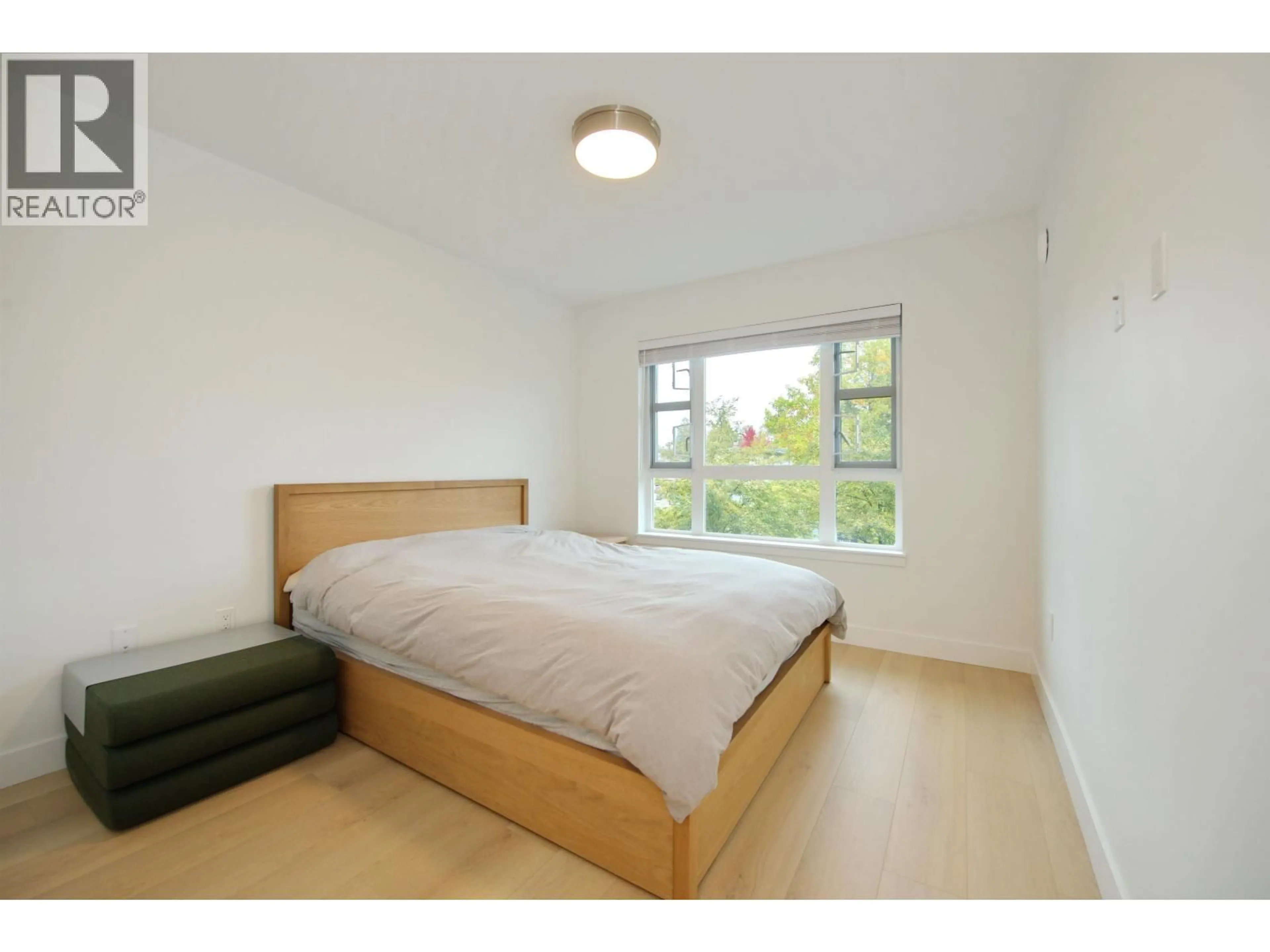 Bedroom with bed, wood/laminate floor for 203 - 22562 121 AVENUE, Maple Ridge British Columbia V2X3Y8