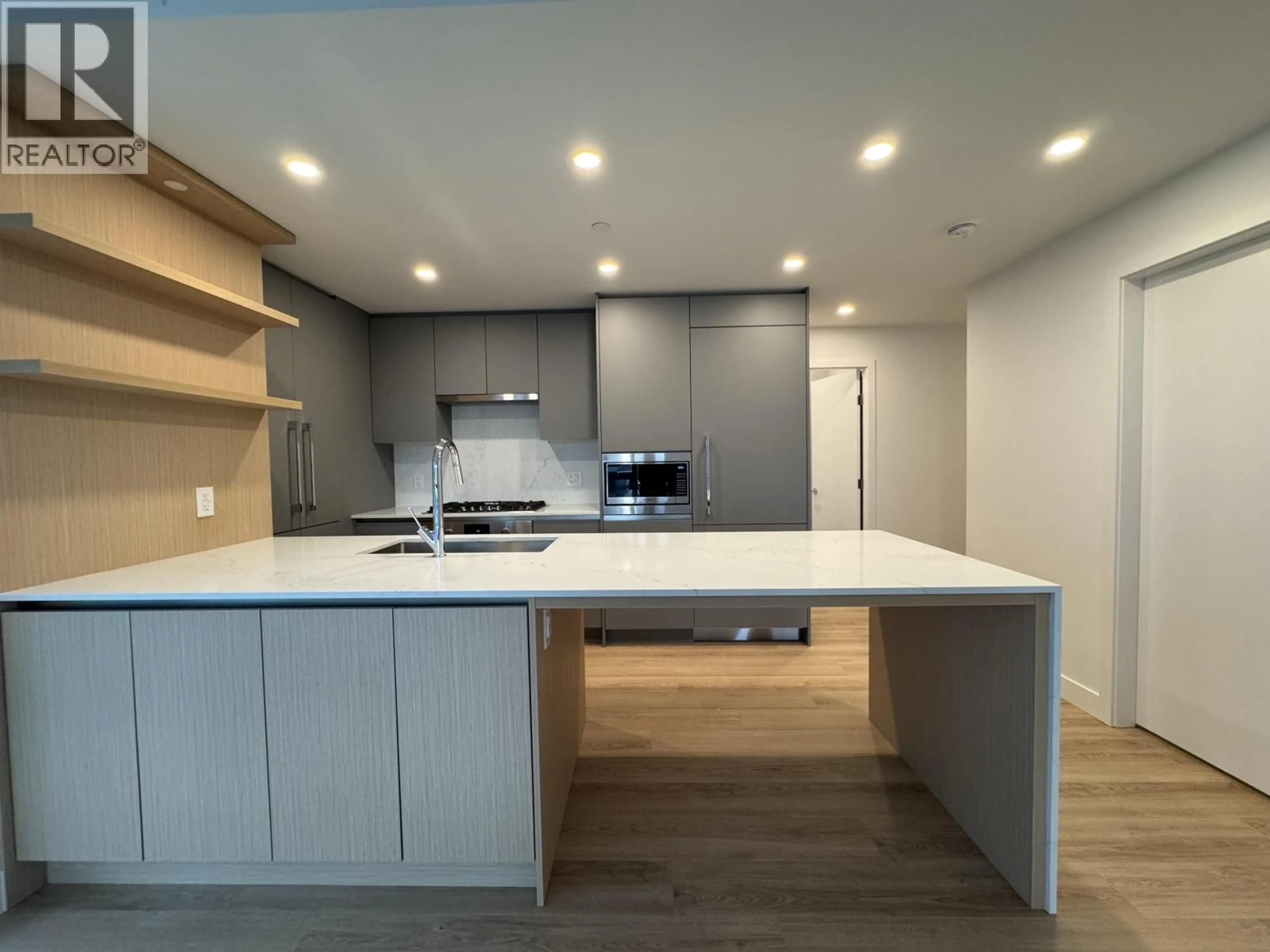 Open concept kitchen, wood/laminate floor for 1103 - 7977 LANSDOWNE ROAD, Richmond British Columbia V6X0X7
